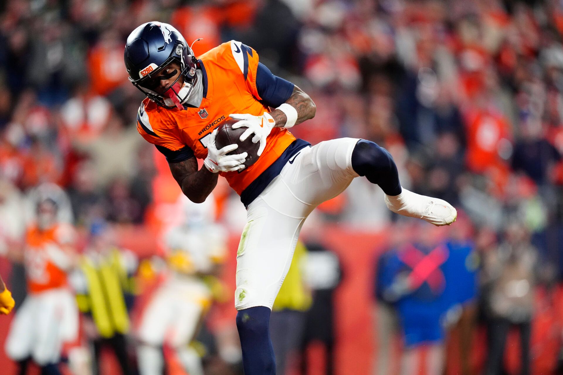 Dec 14, 2025; Denver, Colorado, USA: Denver Broncos wide receiver Troy Franklin (11) celebrates following a touchdown during the third quarter against the Green Bay Packers at Empower Field at Mile High.