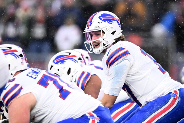 Buffalo Bills quarterback Josh Allen (17) prepares for a snap against the New England Patriots during the second half at Gillette Stadium.