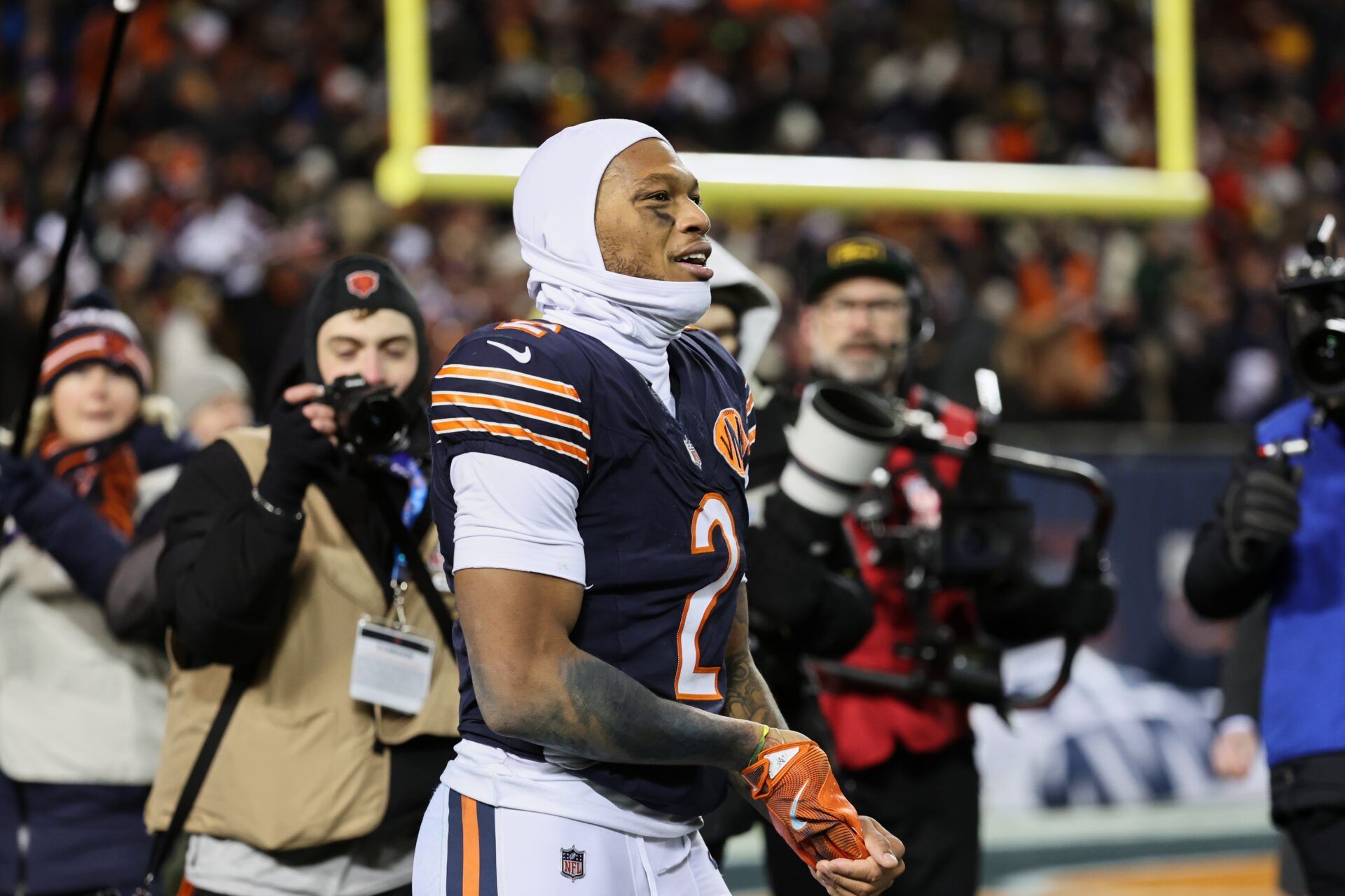 Chicago Bears wide receiver DJ Moore (2) reacts after catching the game-winning forty-six yard touchdown pass thrown by quarterback Caleb Williams (not pictured) in overtime against the Green Bay Packers at Soldier Field.