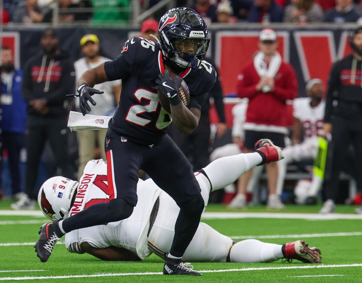 Houston Texans running back Jawhar Jordan (26) breaks the tackle of Arizona Cardinals defensive tackle Dalvin Tomlinson (94) in the first quarter at NRG Stadium.