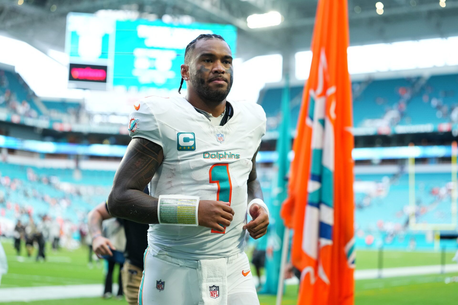 Miami Dolphins quarterback Tua Tagovailoa (1) leaves the field following a game against the New Orleans Saints at Hard Rock Stadium.
