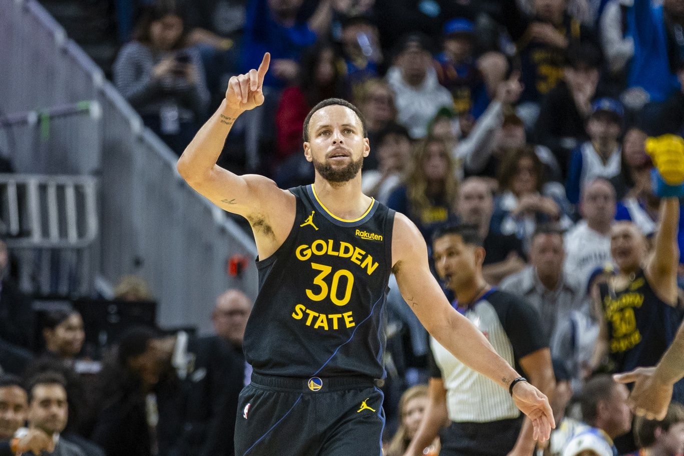Golden State Warriors guard Stephen Curry (30) reacts after scoring against the Phoenix Suns during the fourth quarter at Chase Center.