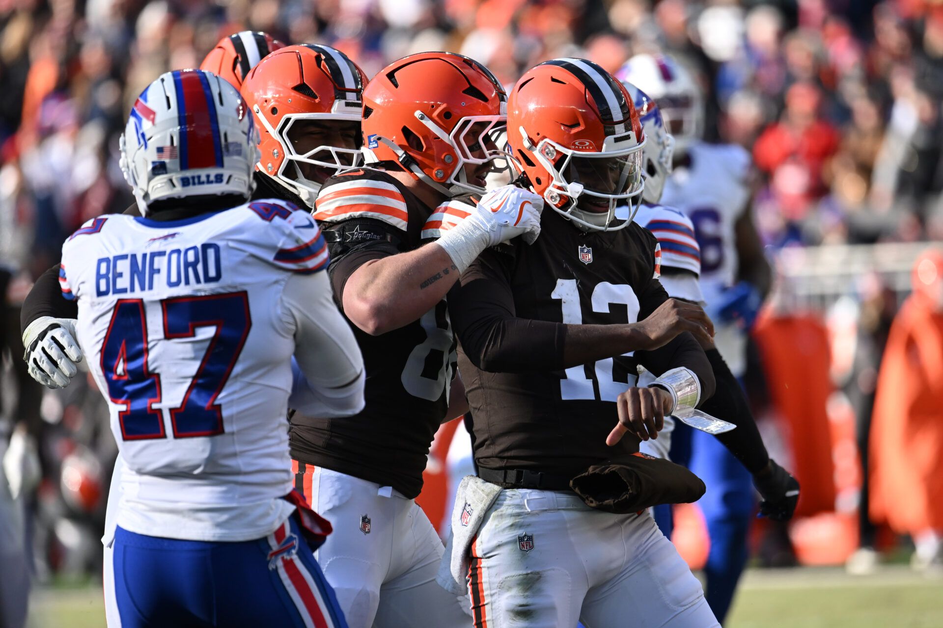 Cleveland Browns quarterback Shedeur Sanders (12) reacts after a 16-yard run against the Buffalo Bills during the first half at Huntington Bank Field.