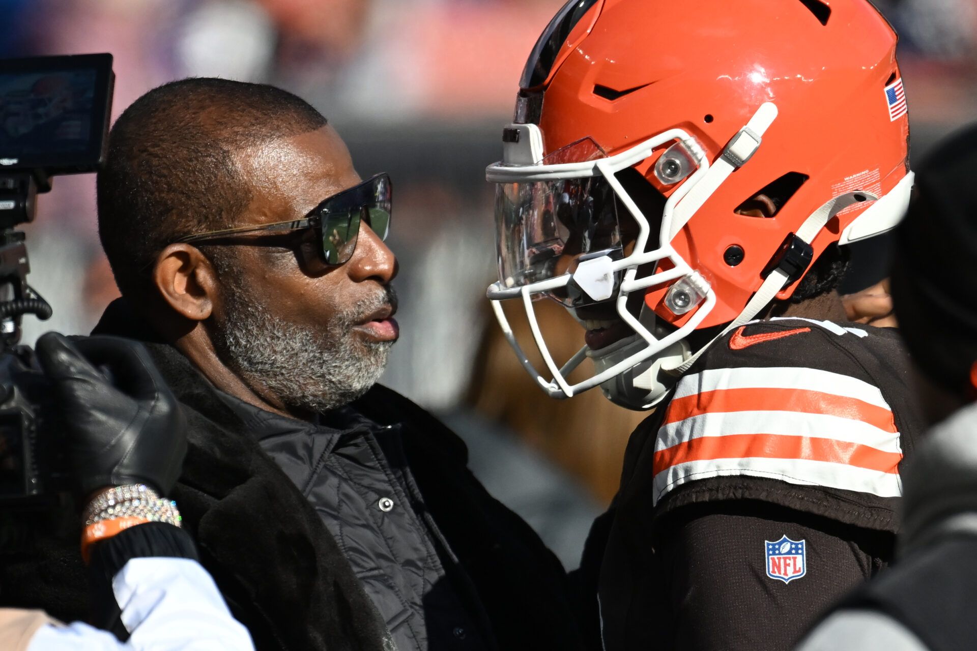Cleveland Browns quarterback Shedeur Sanders (12) and his father Deion Sanders on the sidelines prior to a game against the Buffalo Bills at Huntington Bank Field.