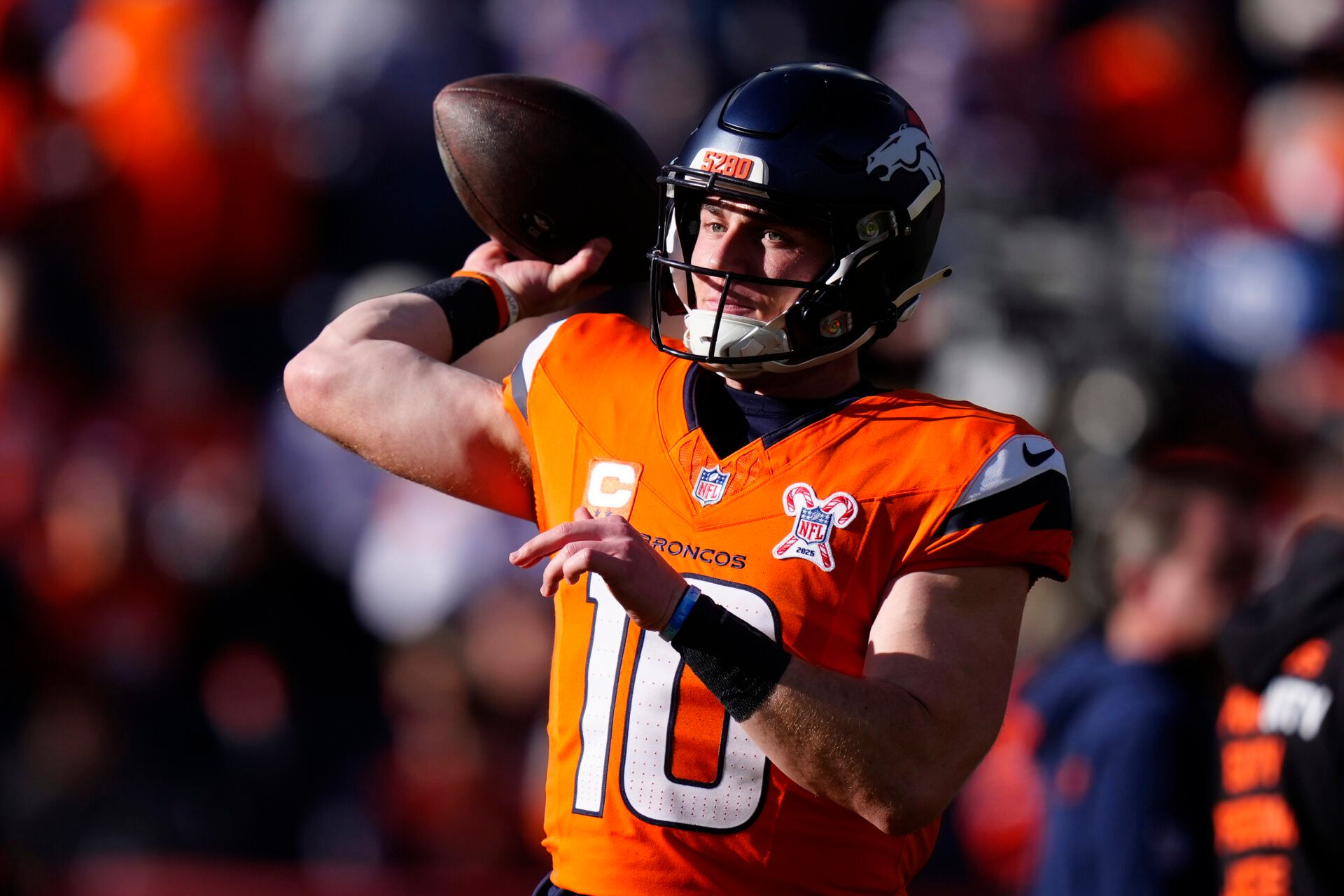 Denver Broncos quarterback Bo Nix (10) practices before the game at Empower Field at Mile High.
