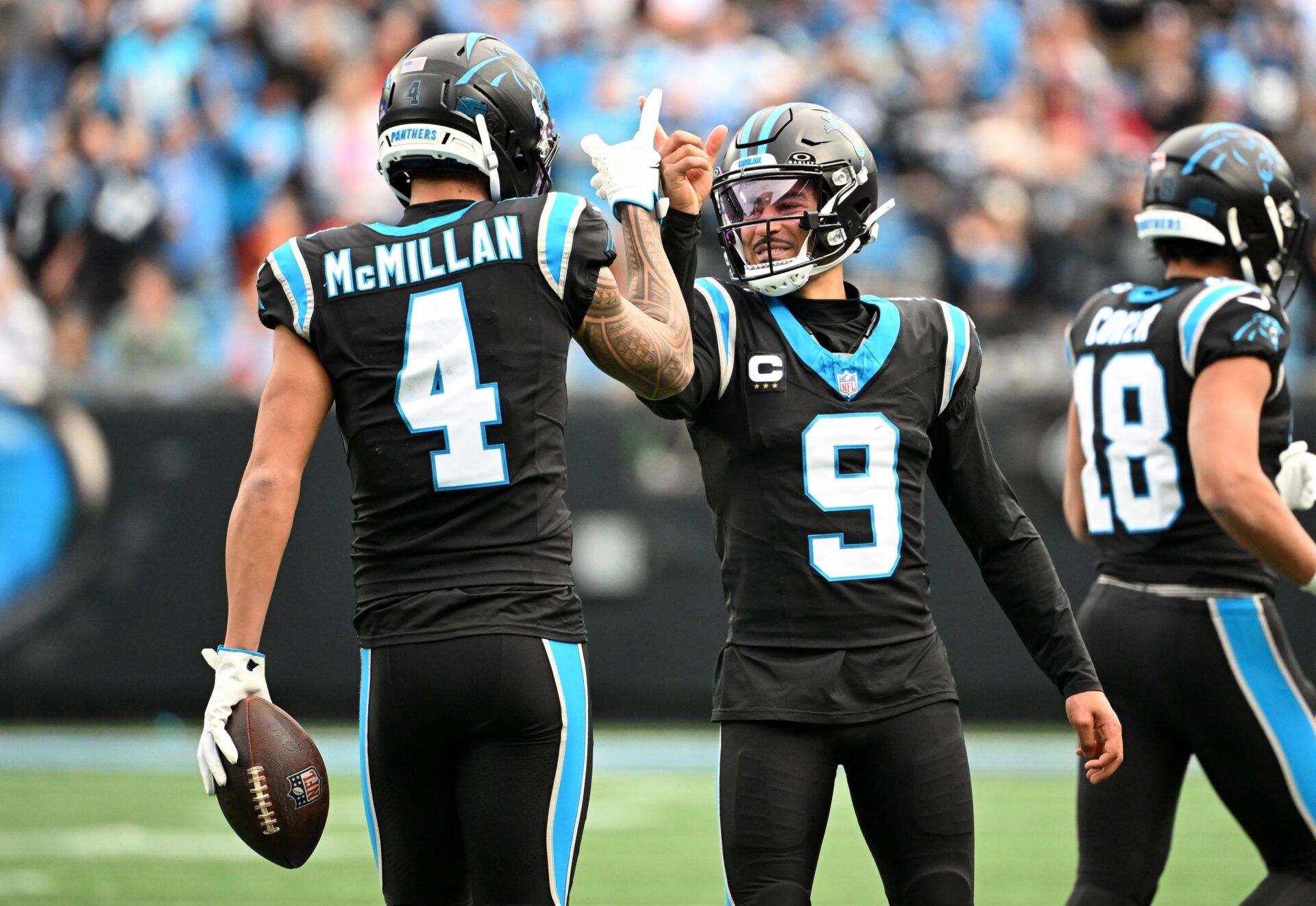 Carolina Panthers quarterback Bryce Young (9) celebrates with wide receiver Tetairoa McMillan (4) after a play during the first half against the Tampa Bay Buccaneers at Bank of America Stadium.