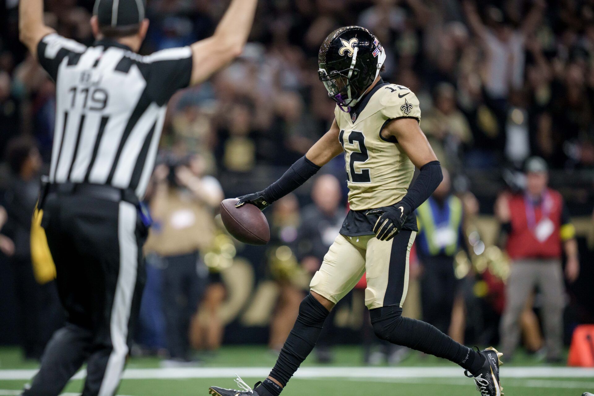 New Orleans Saints wide receiver Chris Olave (12) scores a touchdown against the New York Jets during the fourth quarter at Caesars Superdome.