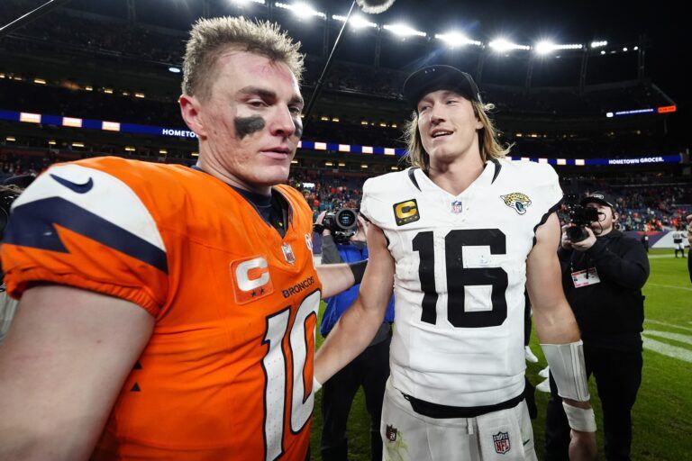 Denver Broncos quarterback Bo Nix (10) and Jacksonville Jaguars quarterback Trevor Lawrence (16) meet after the game at Empower Field at Mile High.