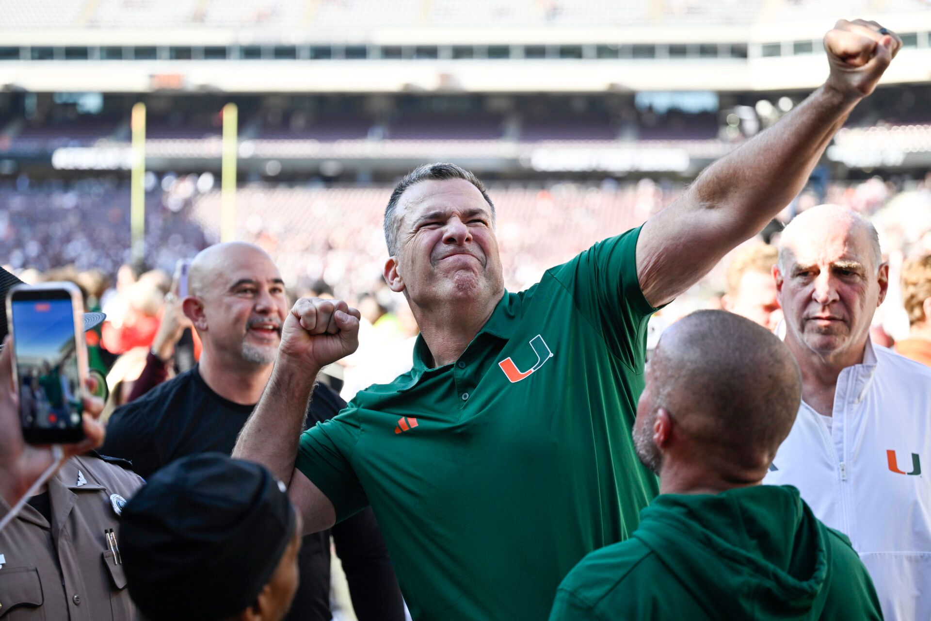 Miami Hurricanes head coach Mario Cristobal celebrates after defeating the Texas A&M Aggies in the first round game of the CFP National Playoff at Kyle Field.