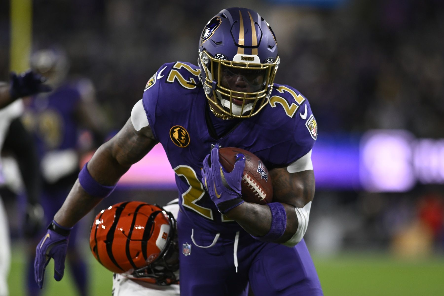 Baltimore Ravens running back Derrick Henry (22) rushes the ball against the Cincinnati Bengals during the first half at M&T Bank Stadium.