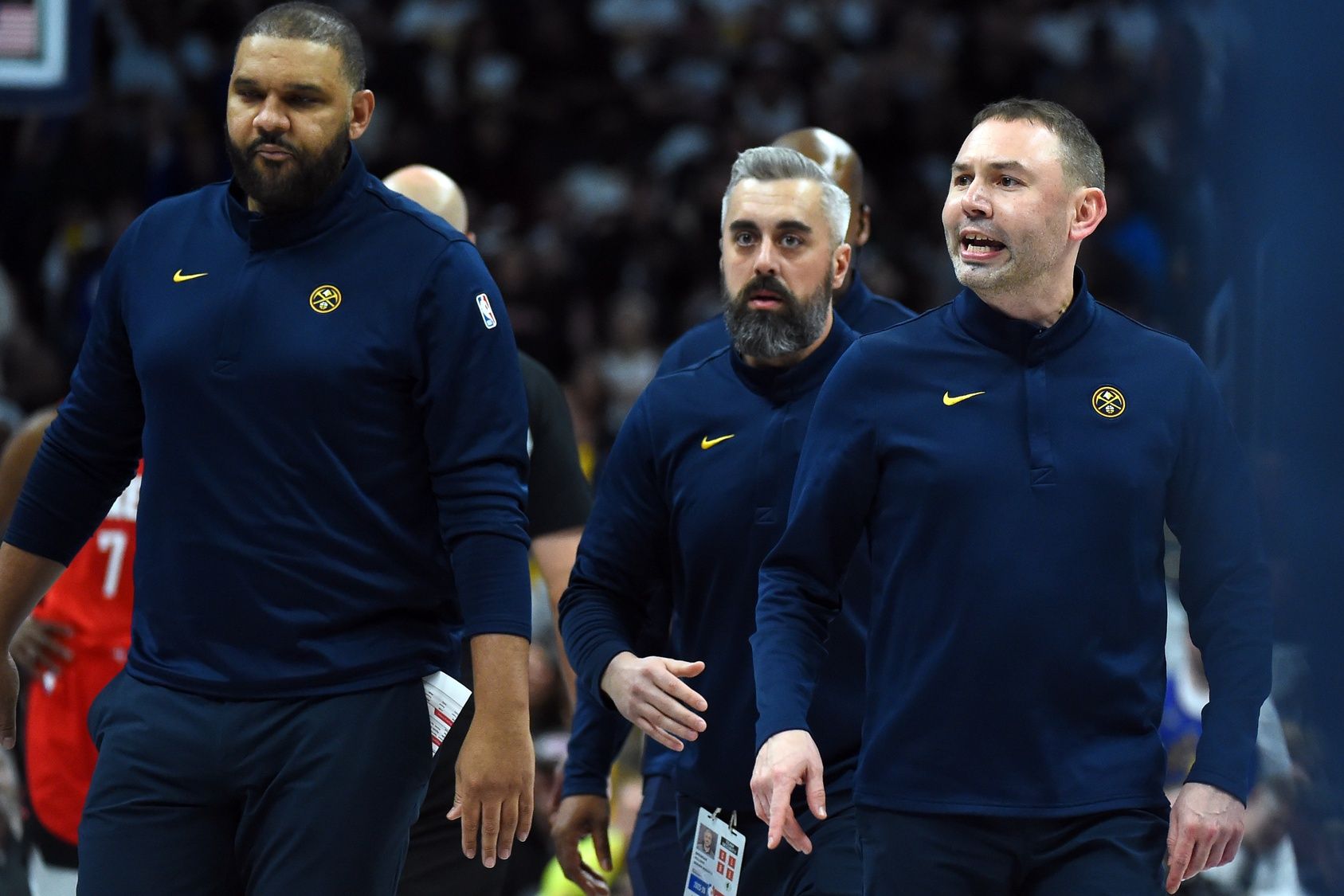 Denver Nuggets head coach David Adelman has to be held back by his coaches before being ejected during the second half against the Houston Rockets at Ball Arena.