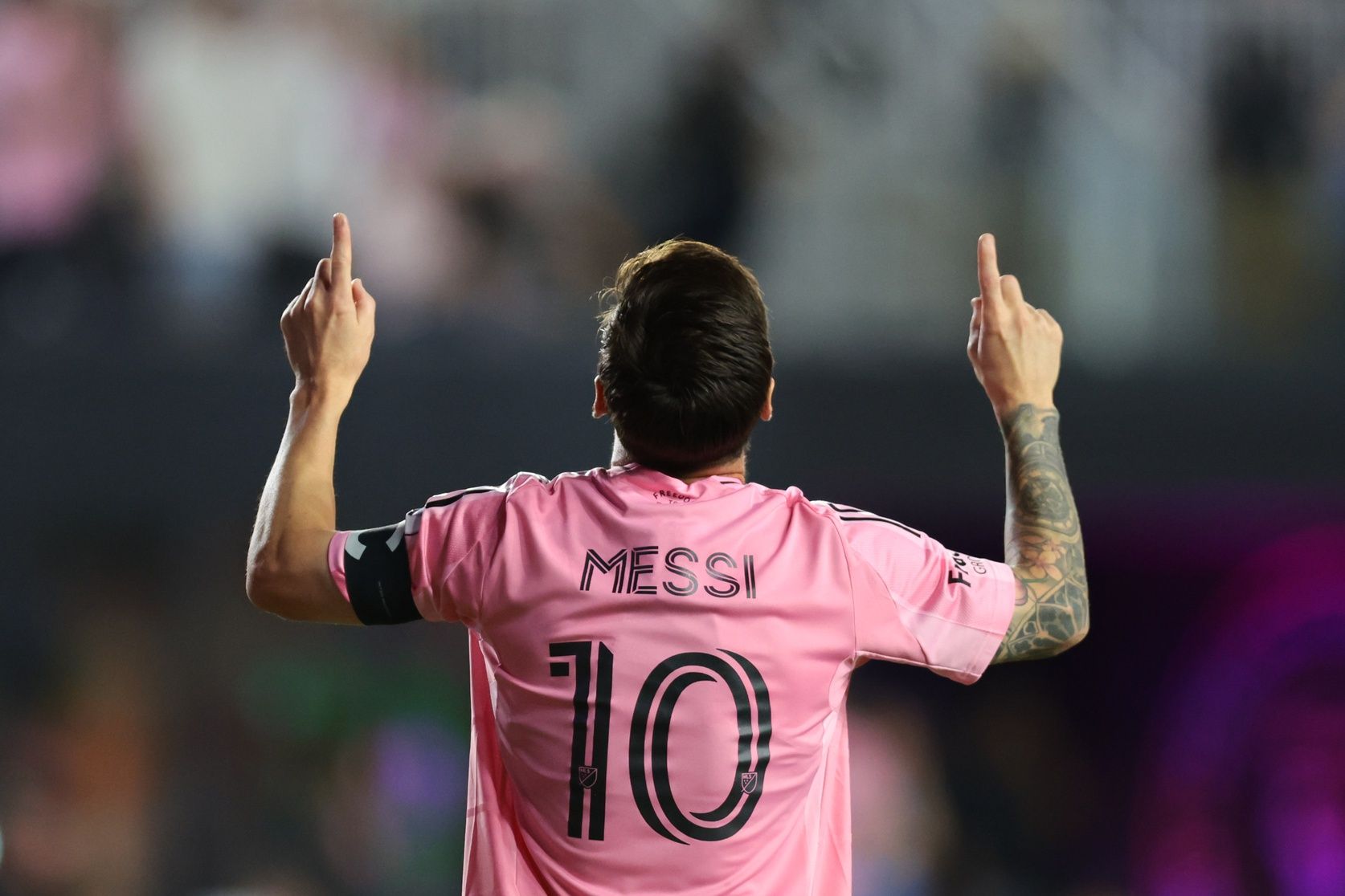 Inter Miami CF forward Lionel Messi (10) celebrates after scoring against Nashville SC during the first half at Chase Stadium.