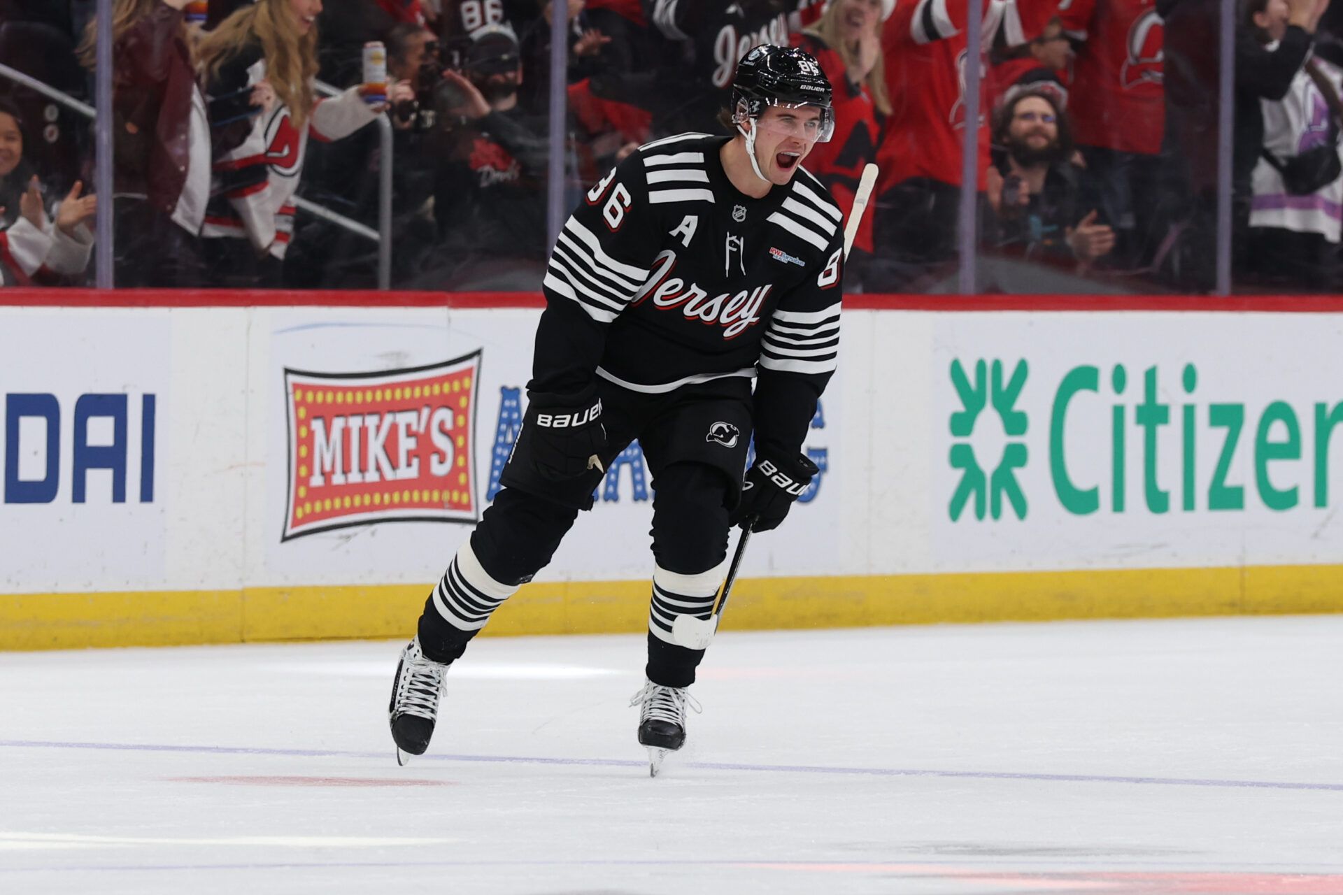 New Jersey Devils center Jack Hughes (86) celebrates his goal against the Buffalo Sabres during the first period at Prudential Center.