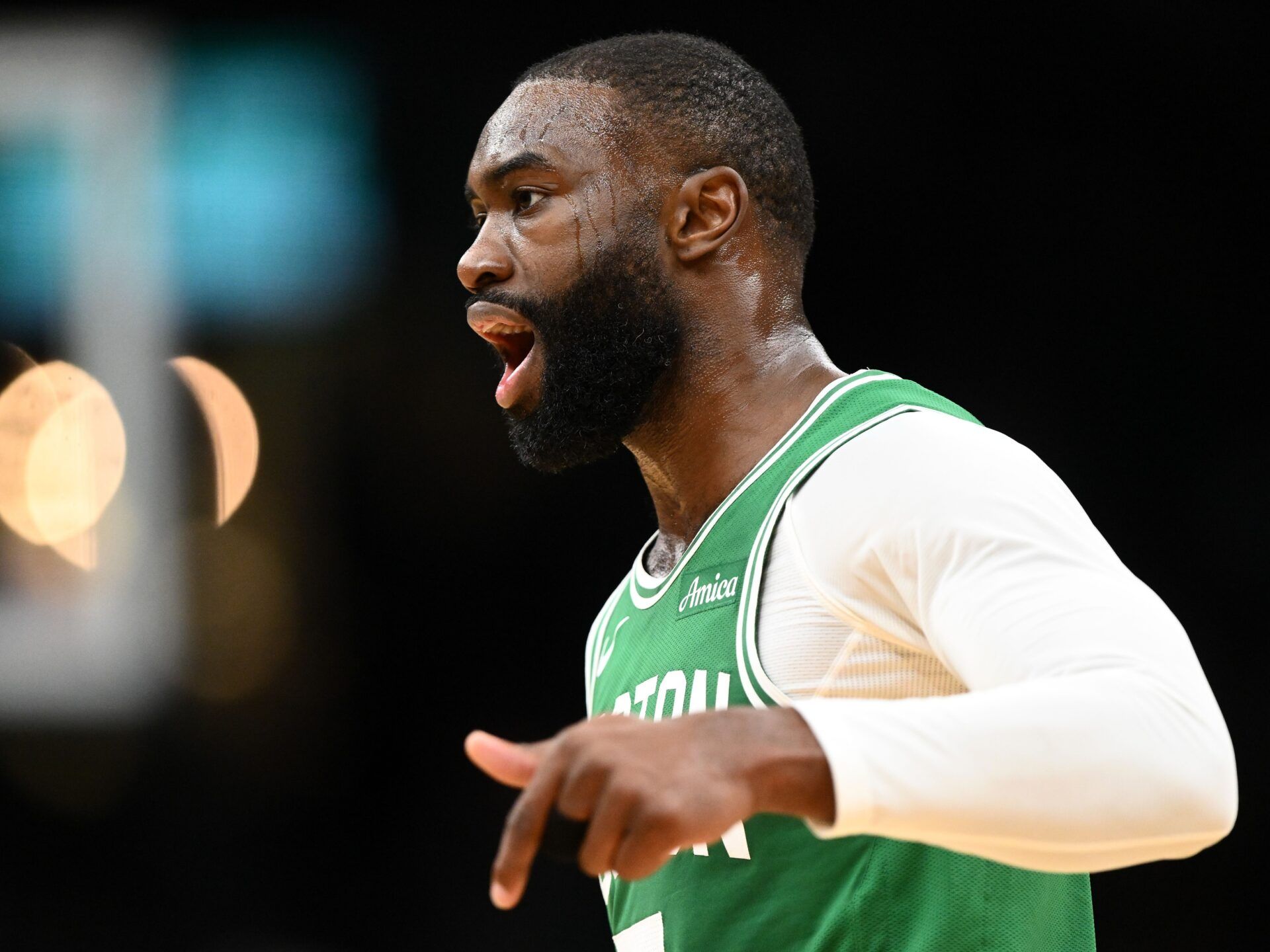 Boston Celtics guard Jaylen Brown (7) reacts after making a three point basket against the New York Knicks during the first half at the TD Garden.