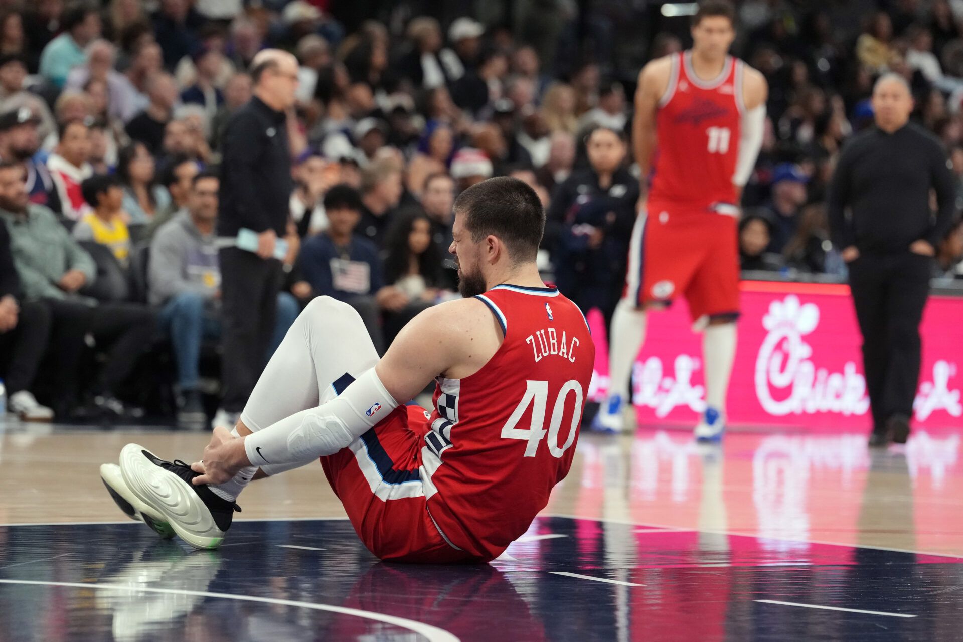 LA Clippers center Ivica Zubac (40) suffers an injury against the Los Angeles Lakers in the first half at Intuit Dome.