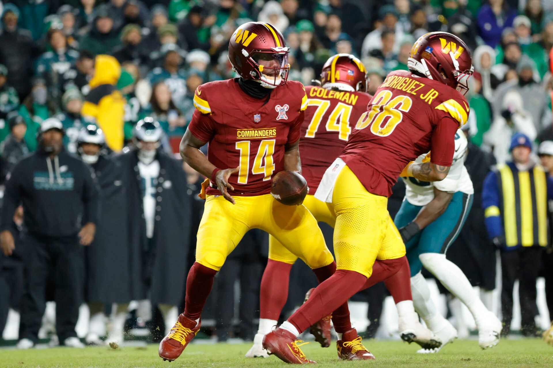 Washington Commanders quarterback Josh Johnson (14) prepares to throw the ball against the Philadelphia Eagles during the second half at Northwest Stadium.