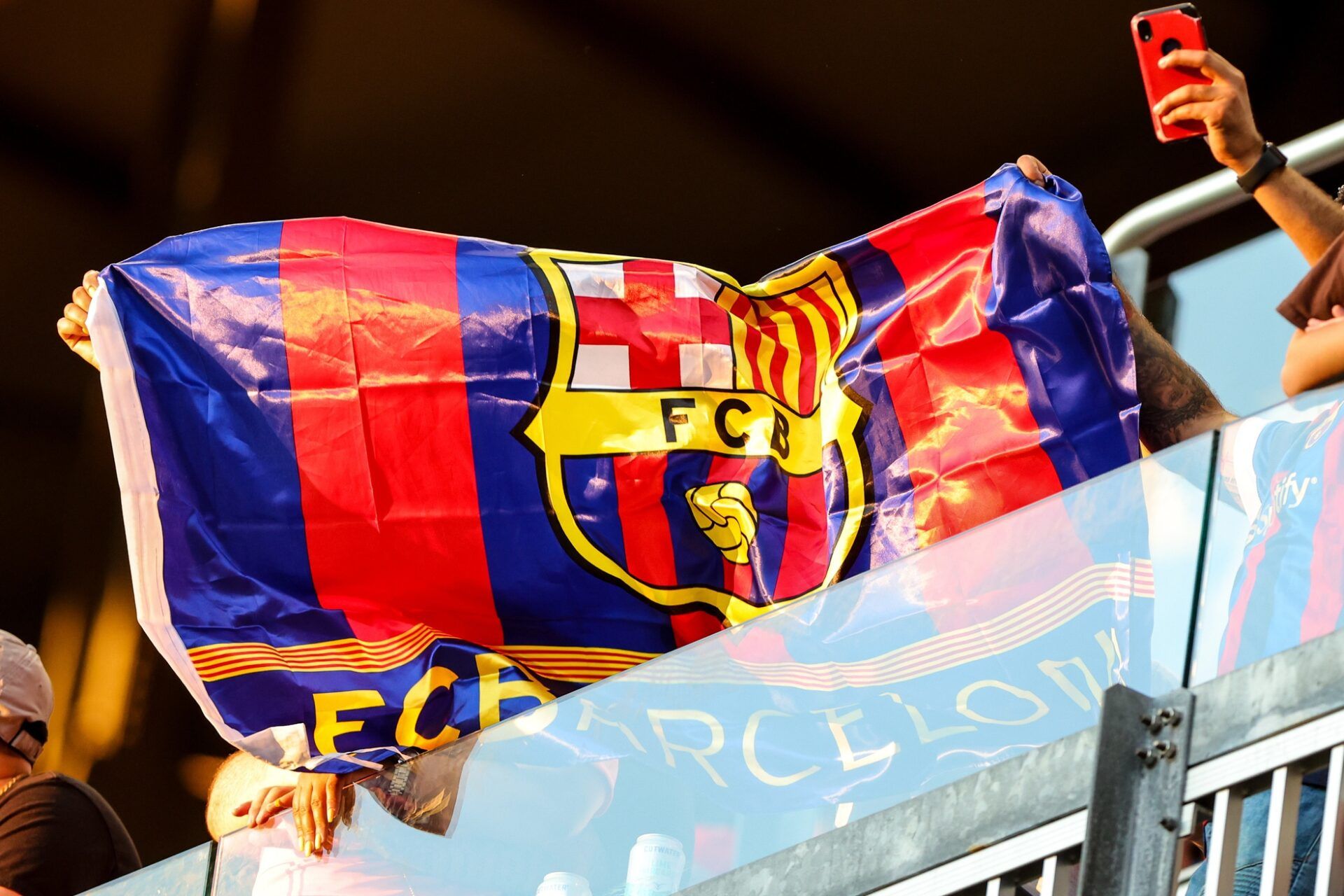 FC Barcelona fans wave a flag during the first half between the New York Red Bulls and FC Barcelona at Red Bull Arena.
