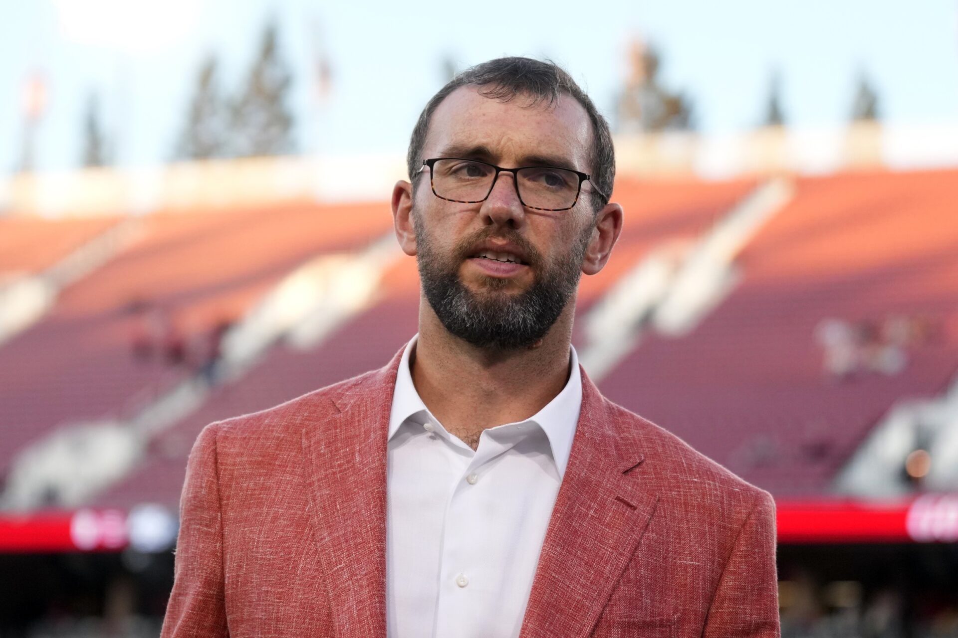 Stanford Cardinal general manager Andrew Luck stands on the field before the game against the Boston College Eagles at Stanford Stadium.