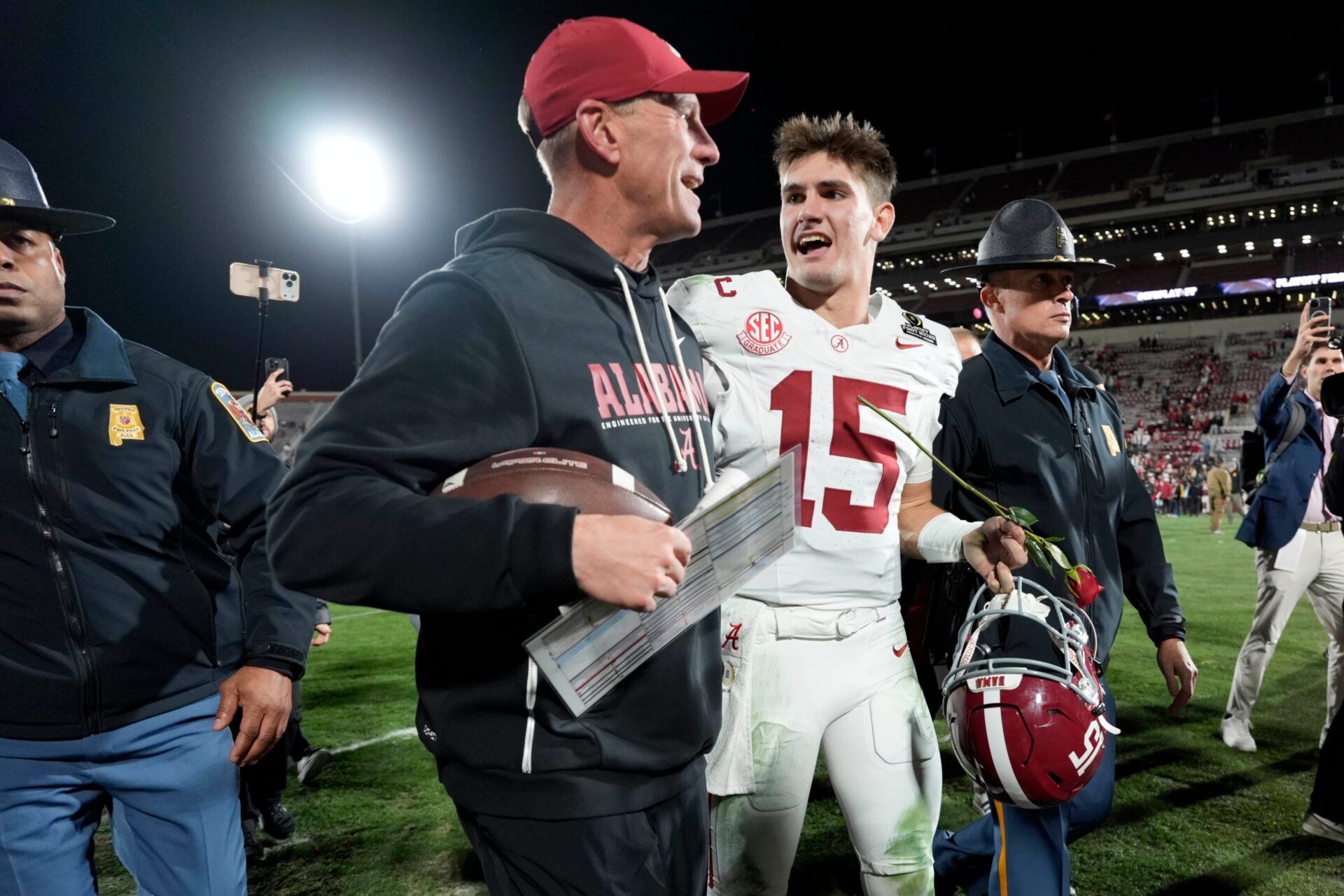 Alabama Crimson Tide quarterback Ty Simpson (15) and coach Kalen DeBoer walk off the field after first-round College Football Playoff game between the University of Oklahoma Sooners (OU) and the Alabama Crimson Tide at Gaylord Family – Oklahoma Memorial Stadium in Norman, Okla., Friday, Dec. 19, 2025. Alabama won 34-24.