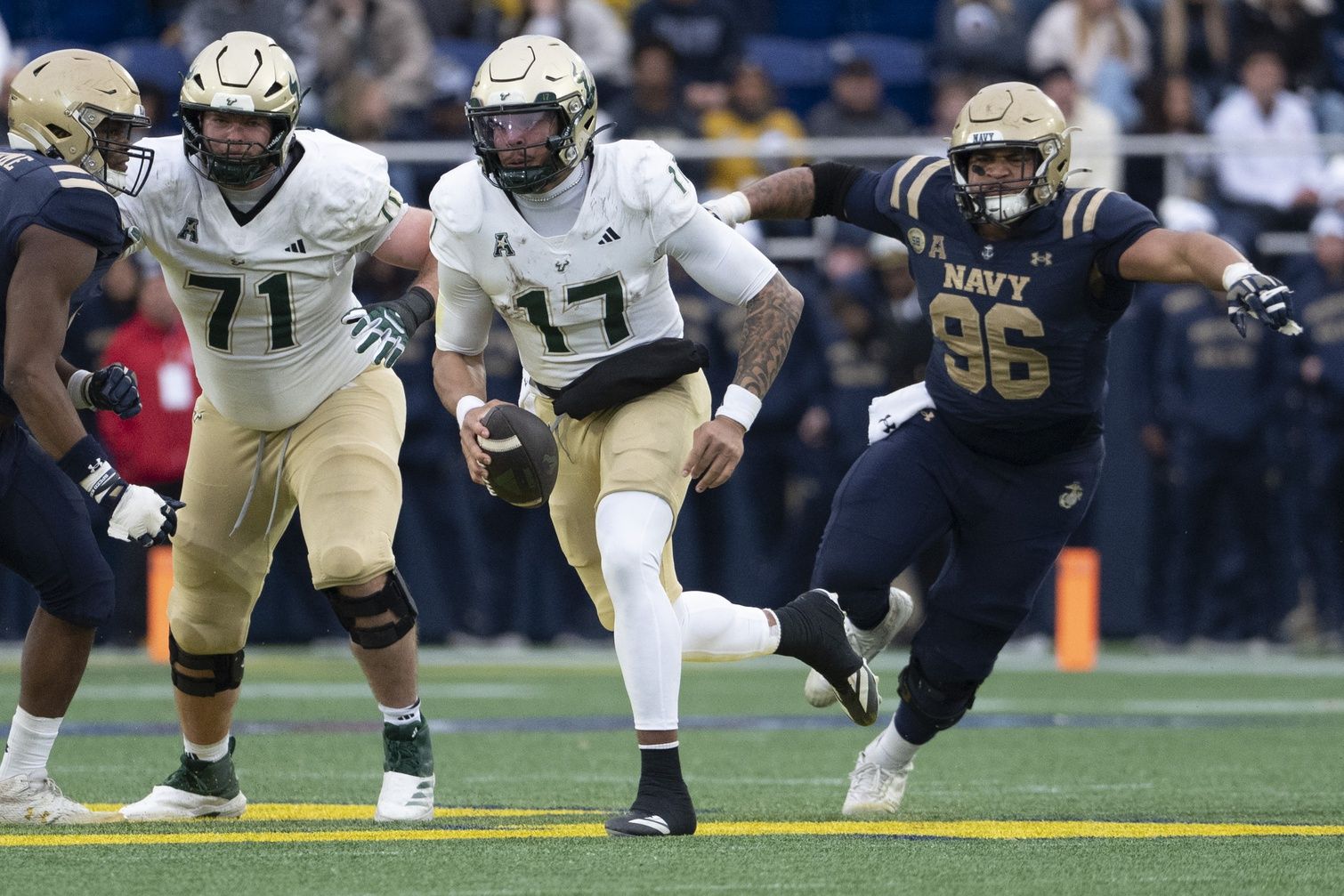 South Florida Bulls quarterback Byrum Brown (17) scrambles  during the second half against the Navy Midshipmen at Navy-Marine Corps Memorial Stadium. Navy Midshipmen defeated South Florida Bulls 41-28.