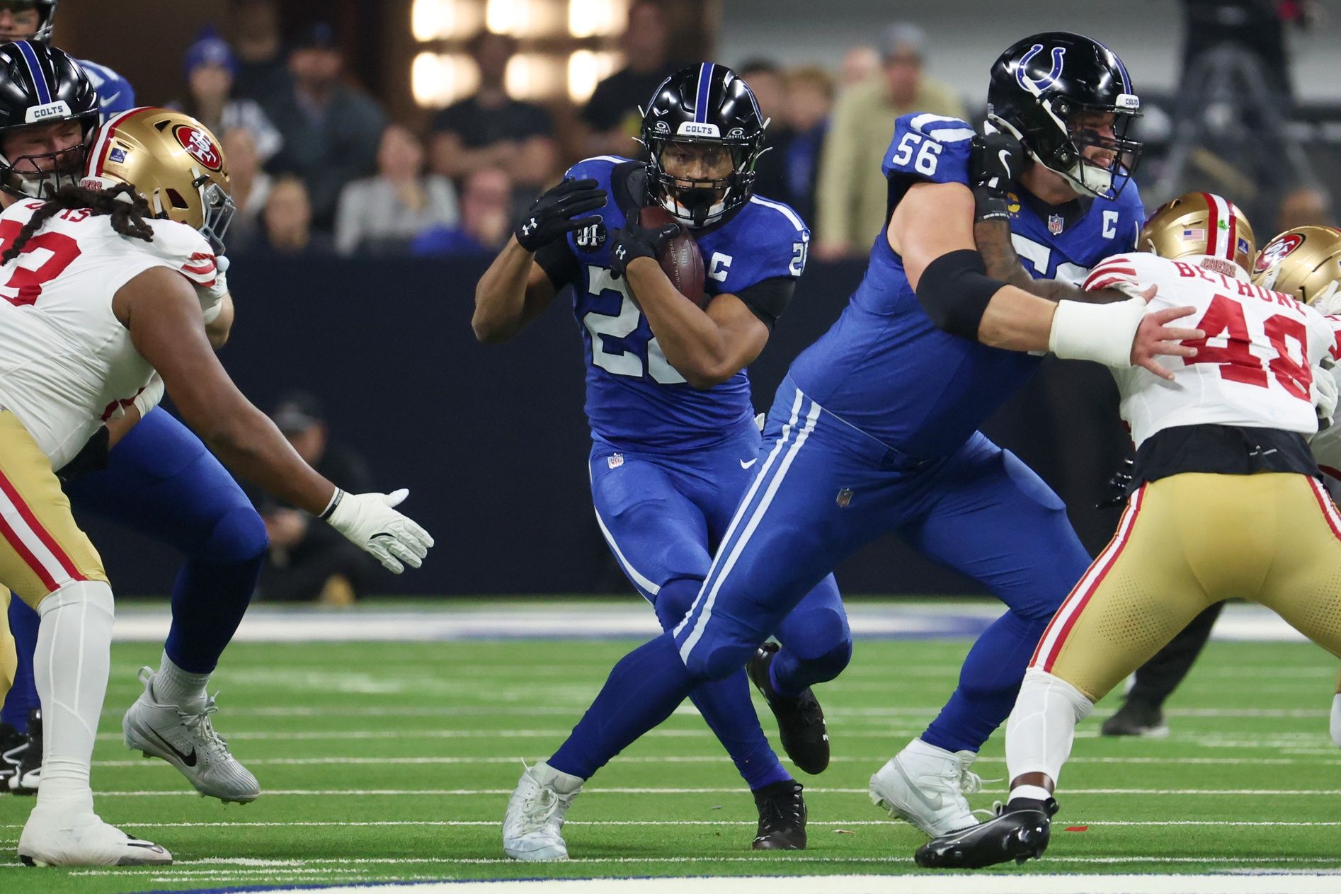 Indianapolis Colts running back Jonathan Taylor (28) carries the ball against the San Francisco 49ers in the first quarter of the game at Lucas Oil Stadium.