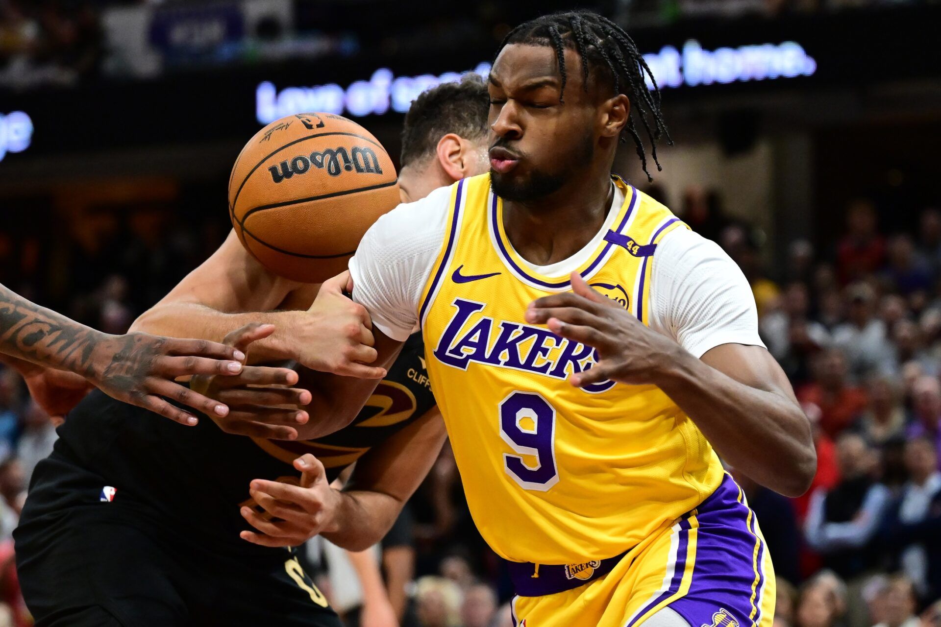 Los Angeles Lakers guard Bronny James (9) knocks the ball away from Cleveland Cavaliers forward Georges Niang (20) during the second half at Rocket Mortgage FieldHouse.