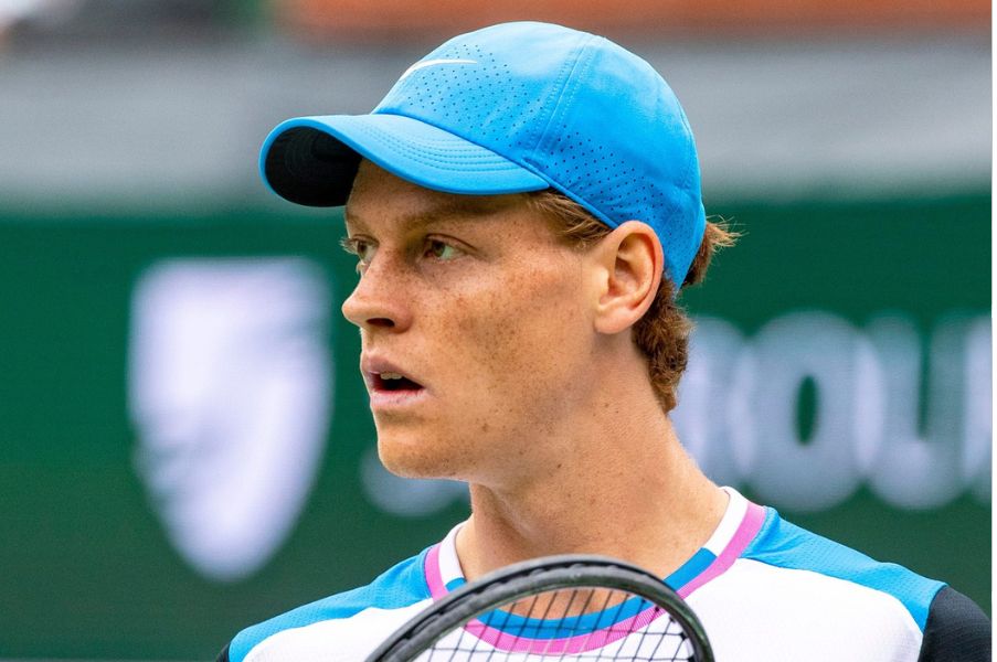 Jannik Sinner looks across the court to Carlos Alcaraz as he waits for a serve during the ATP semifinals of the BNP Paribas Open in Indian Wells, Calif., Saturday, March 16, 2024.