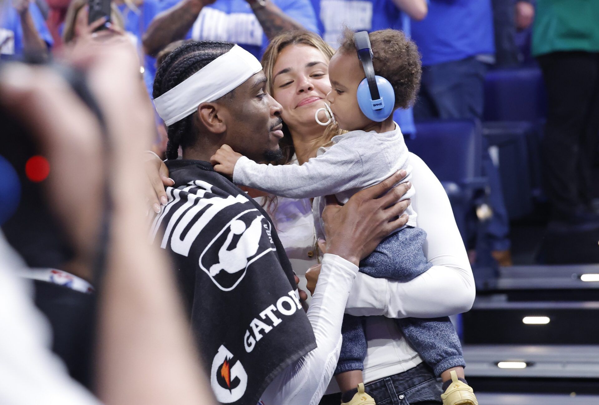 Oklahoma City Thunder guard Shai Gilgeous-Alexander (2) holds his son Ares Alexander alongside his wife Hailey Summers after his team defeated the Denver Nuggets during game five of the second round for the 2025 NBA Playoffs at Paycom Center.