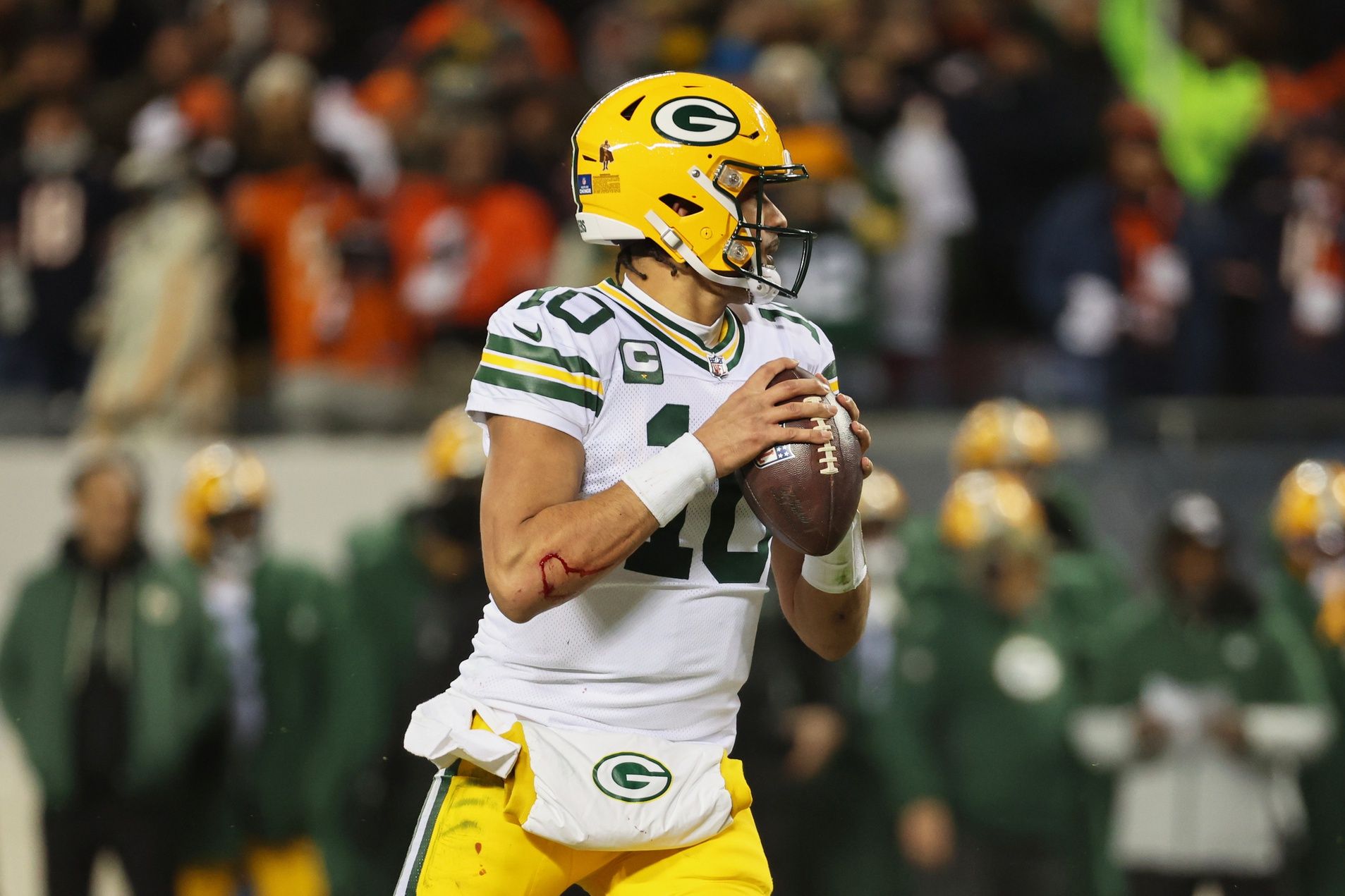 Green Bay Packers quarterback Jordan Love (10) looks to throw a pass against the Chicago Bears during the second quarter at Soldier Field.