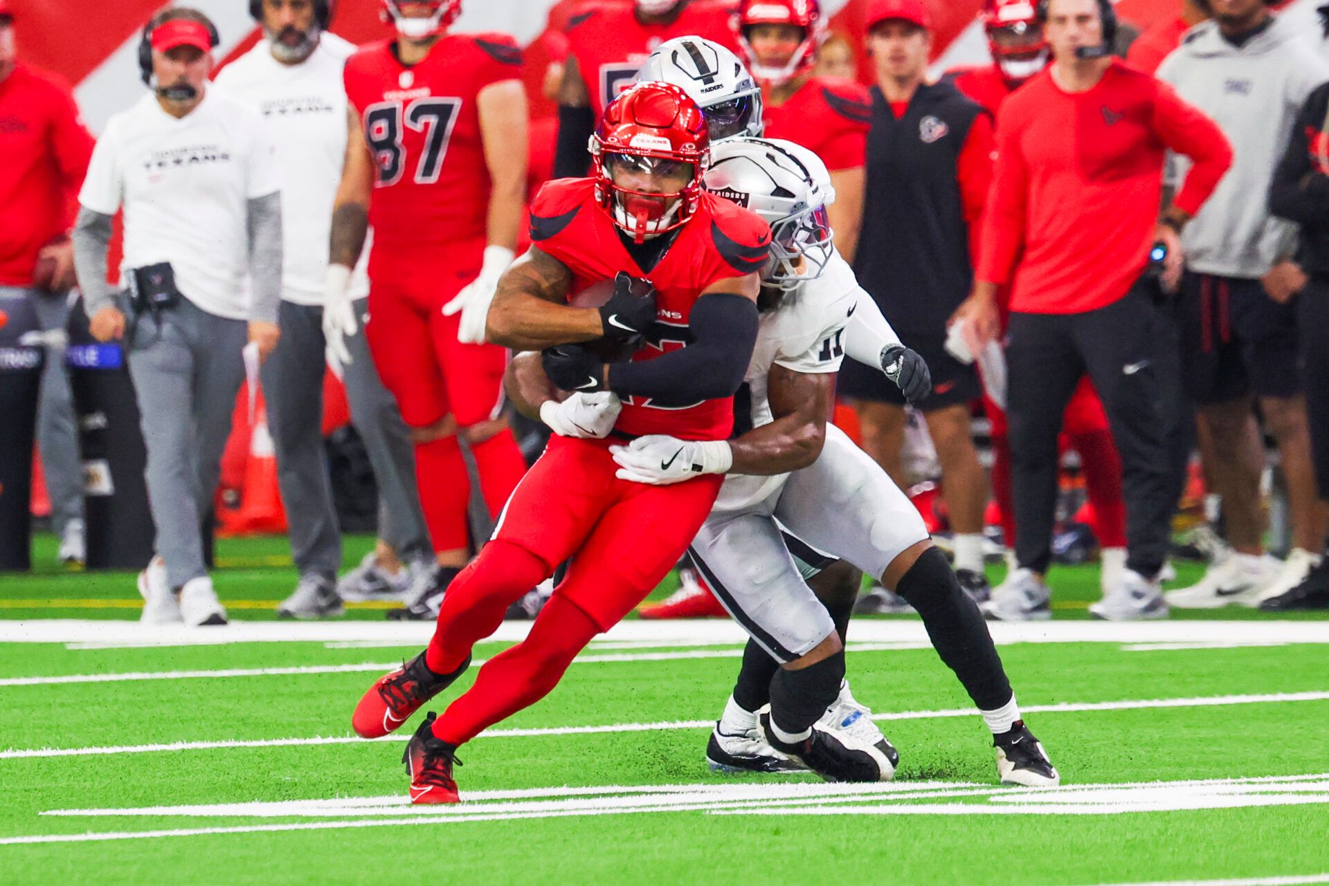 Houston Texans wide receiver Nico Collins (12) runs for yards after the catch against the Las Vegas Raiders during the second quarter at NRG Stadium.