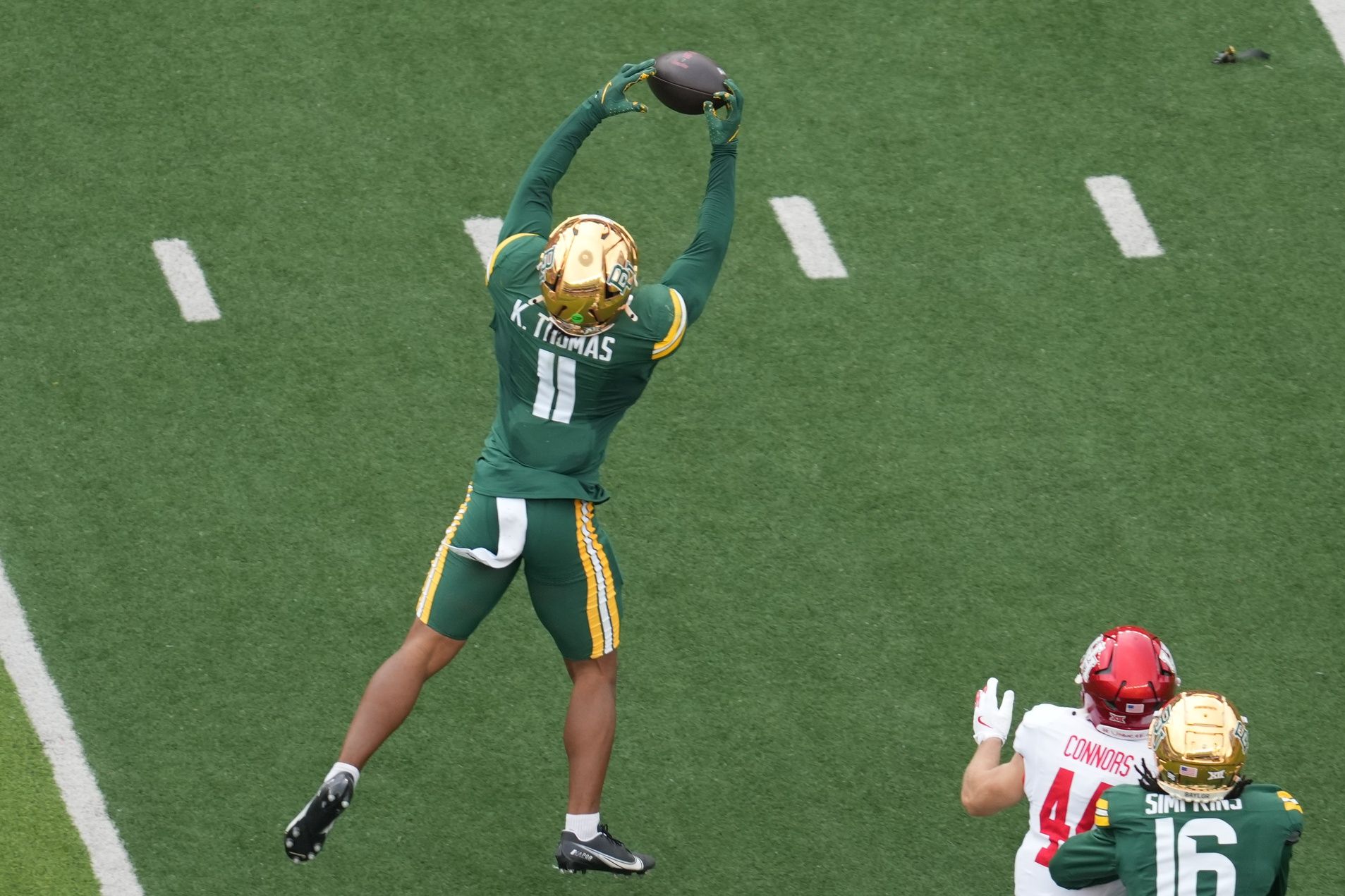 Baylor Bears linebacker Keaton Thomas (11) intercepts a pass intended for Houston Cougars running back Dean Connors (44) during the first half at McLane Stadium.