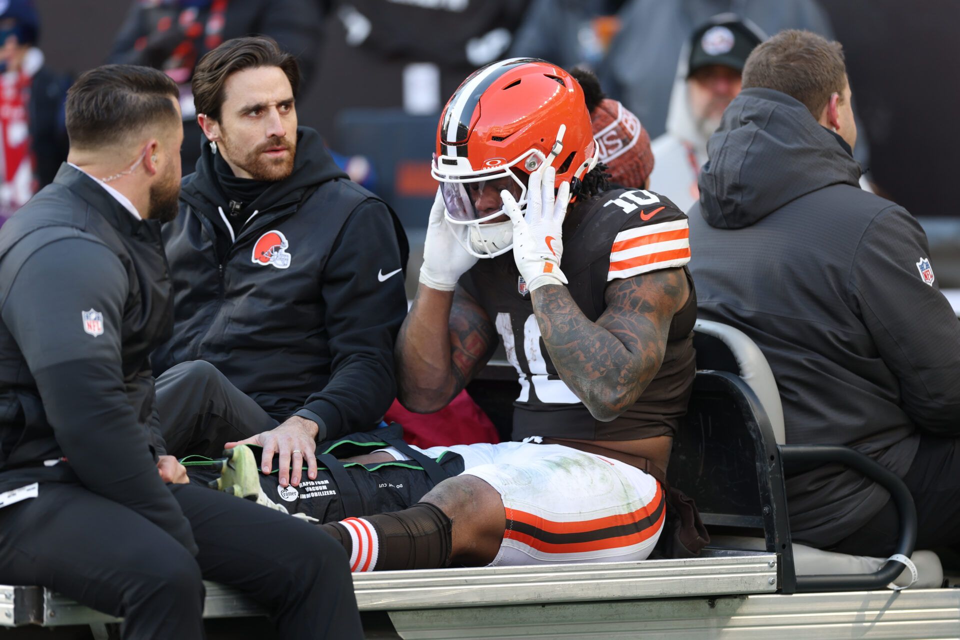 Cleveland Browns running back Quinshon Judkins (10) is carted off the field after going down with an apparent injury against the Buffalo Bills during the first half at Huntington Bank Field.