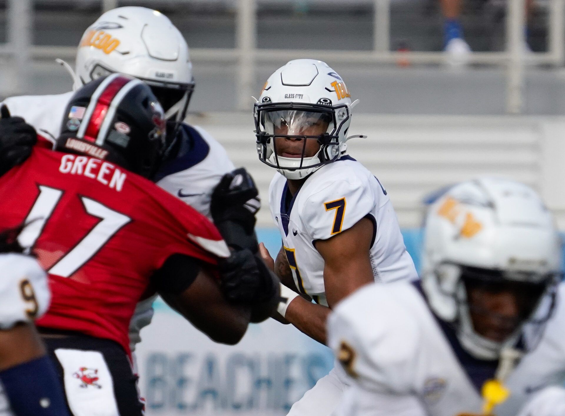 Toledo Rockets quarterback Kalieb Osborne (7) looks to pass against the Louisville Cardinals in the first quarter at Flagler CU Stadium.