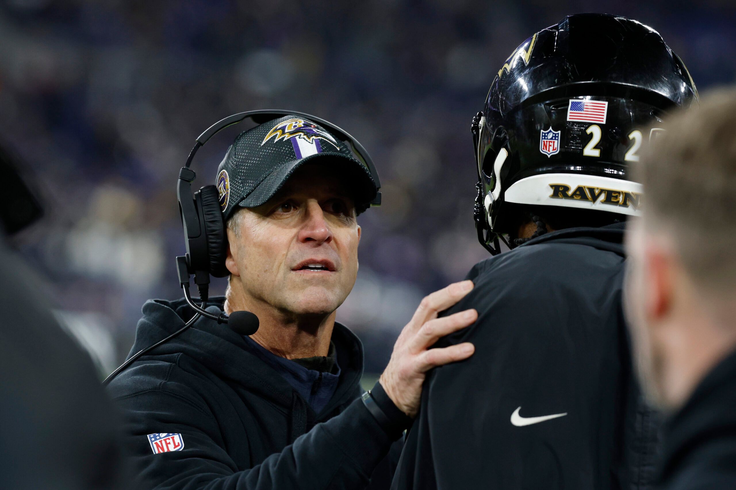 Baltimore Ravens head coach John Harbaugh celebrates with running back Derrick Henry (22) after defeating the Pittsburgh Steelers in an AFC wild card game at M&T Bank Stadium.