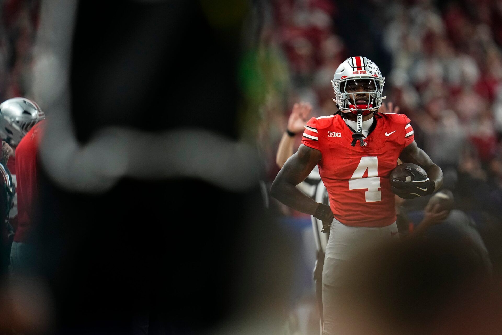 Ohio State Buckeyes wide receiver Jeremiah Smith (4) reacts after making a catch during the Big Ten Conference championship game against the Indiana Hoosiers at Lucas Oil Stadium in Indianapolis on Dec. 6, 2025. Ohio State lost 13-10.