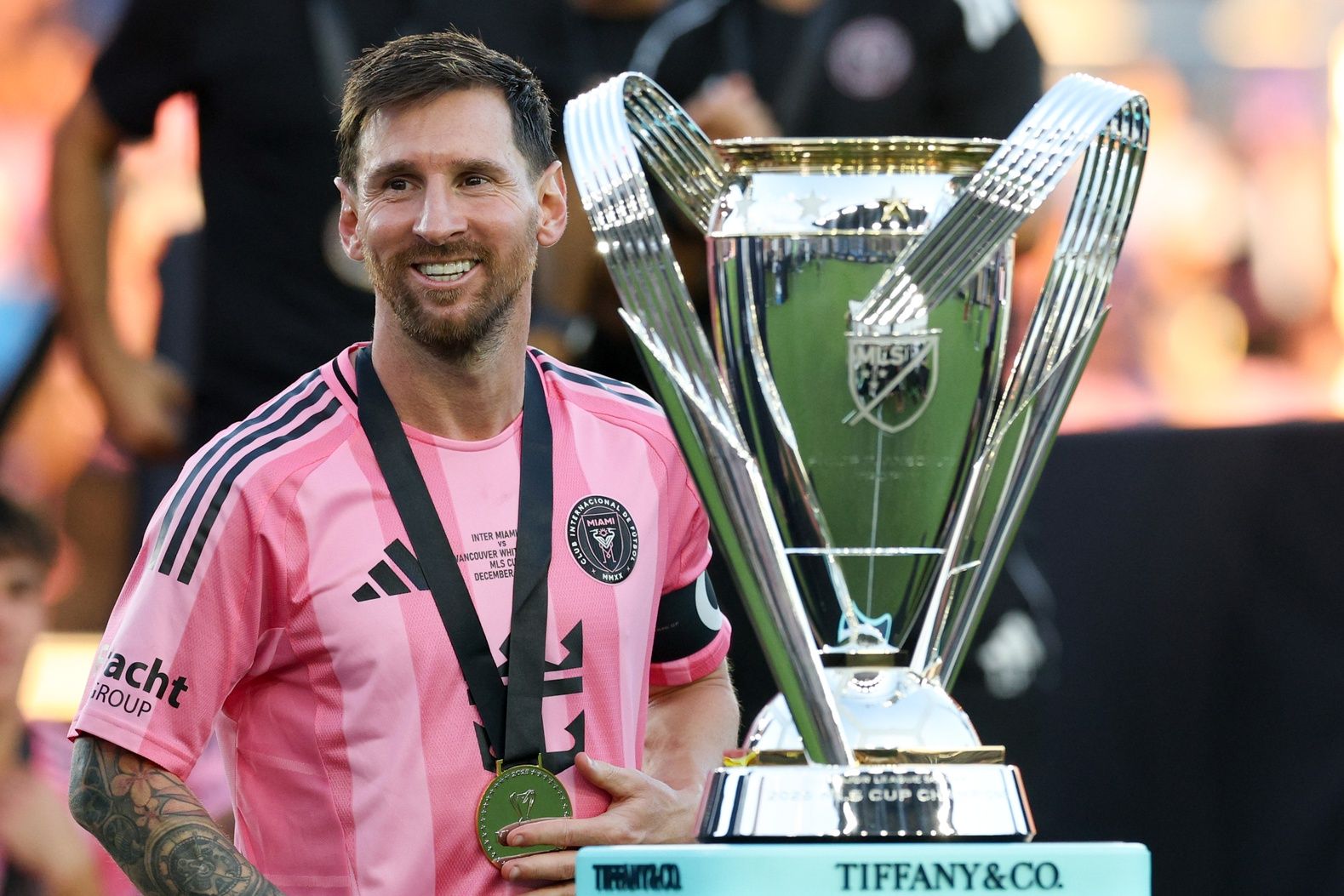 Inter Miami forward Lionel Messi (10) looks on with the Philip F. Anschutz trophy after winning the 2025 MLS Cup against the Vancouver Whitecaps FC at Chase Stadium.