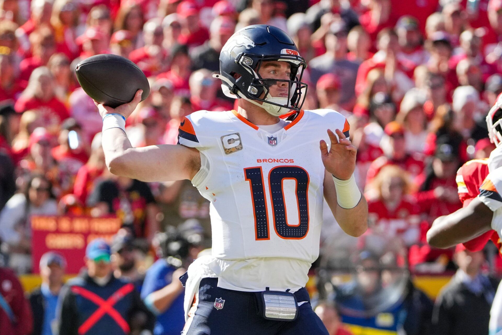 Denver Broncos quarterback Bo Nix (10) throws a pass against the Kansas City Chiefs during the first half at GEHA Field at Arrowhead Stadium.