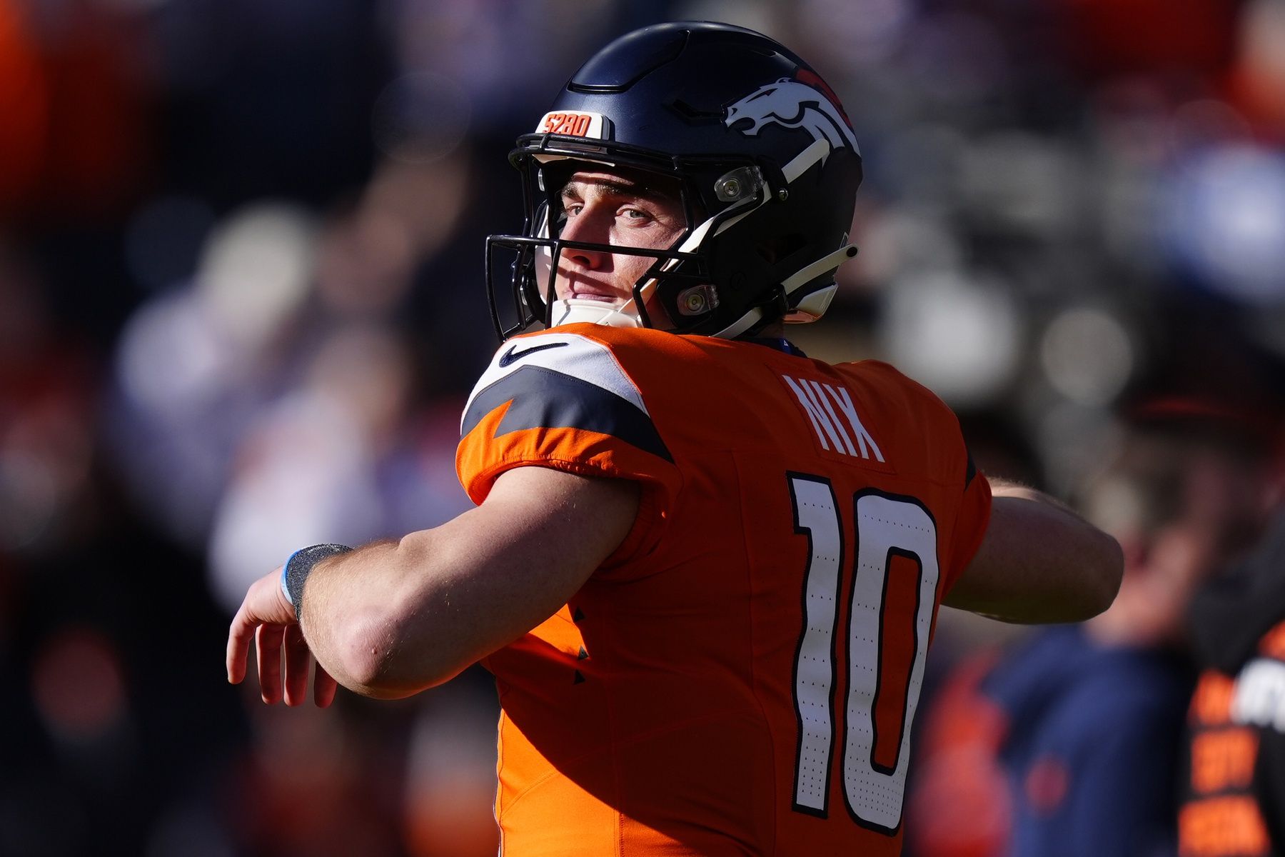 Denver Broncos quarterback Bo Nix (10) practices before the game at Empower Field at Mile High.