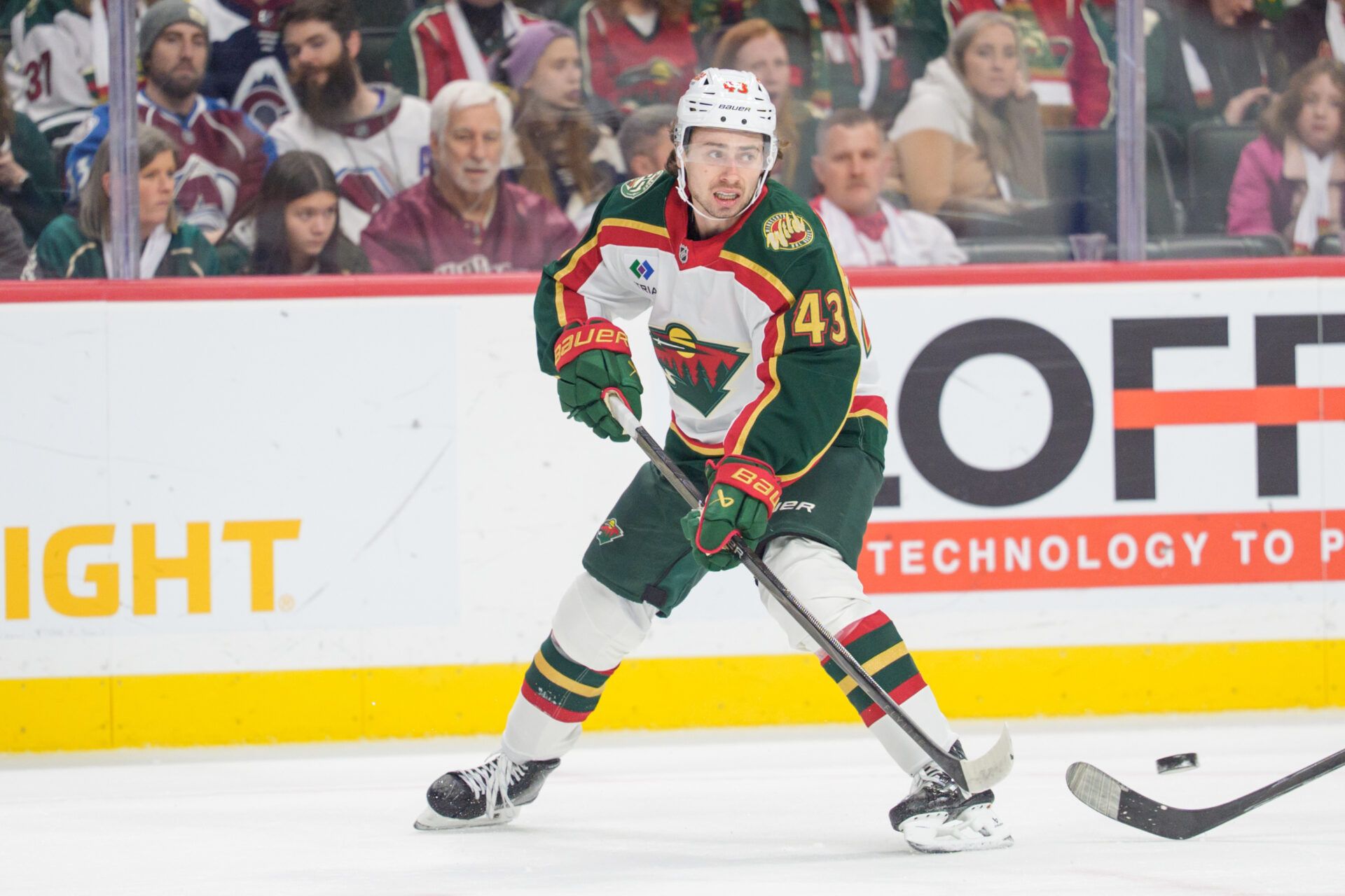 Minnesota Wild defenseman Quinn Hughes (43) clears the puck in the first period against the Colorado Avalanche at Grand Casino Arena.