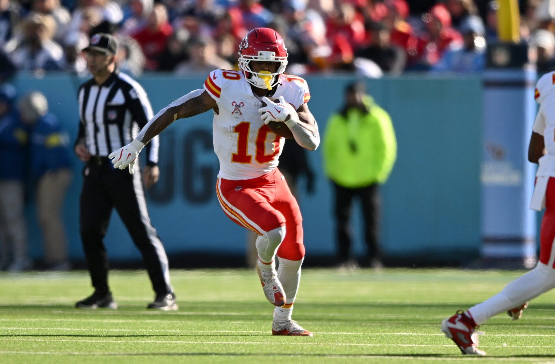 Kansas City Chiefs running back Isiah Pacheco (10) runs during the first half against the Tennessee Titans at Nissan Stadium.