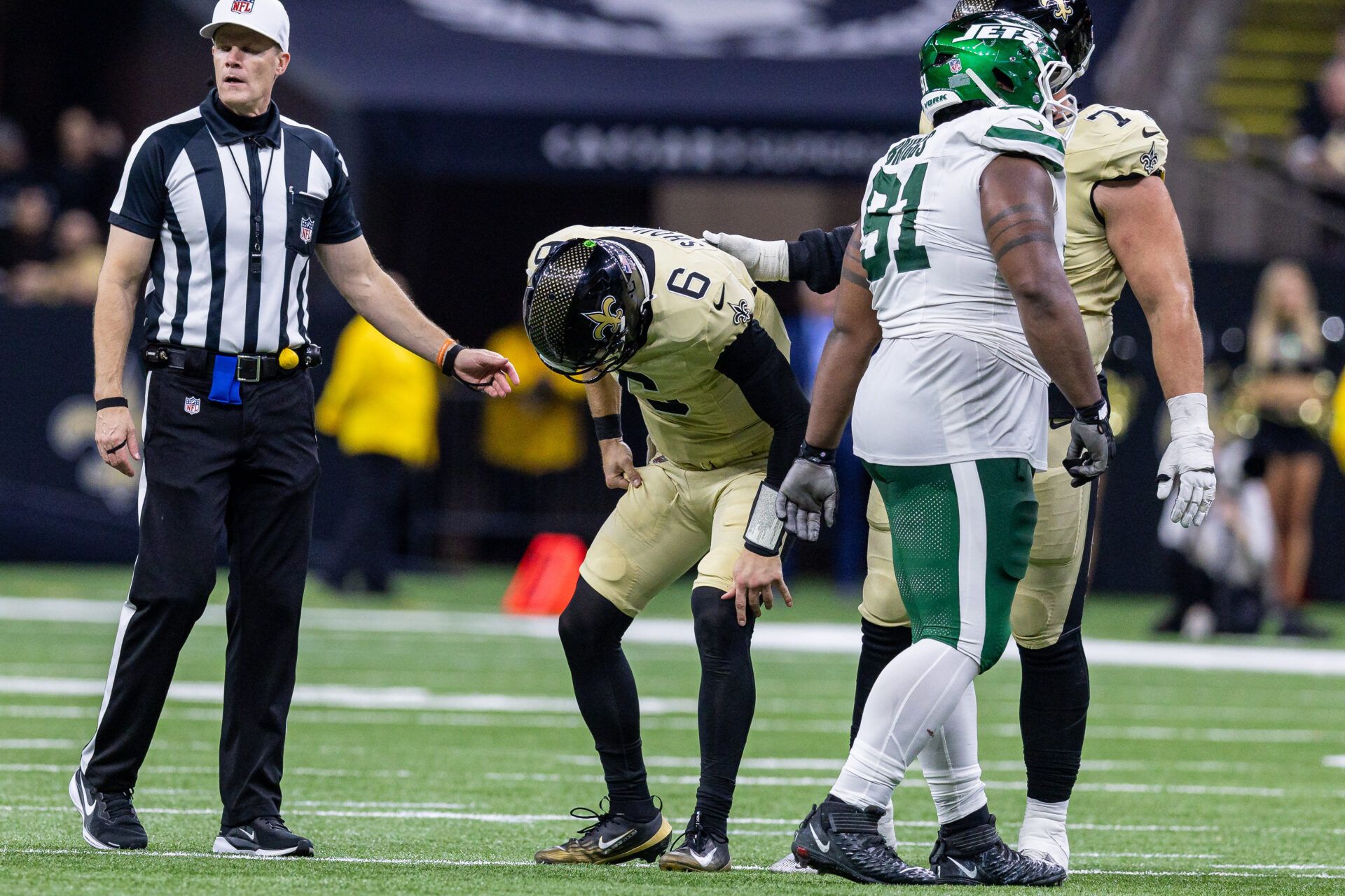 New Orleans Saints quarterback Tyler Shough (6) gets up after a tackle by New York Jets defensive end Jowon Briggs (91) during the second half  at Caesars Superdome.