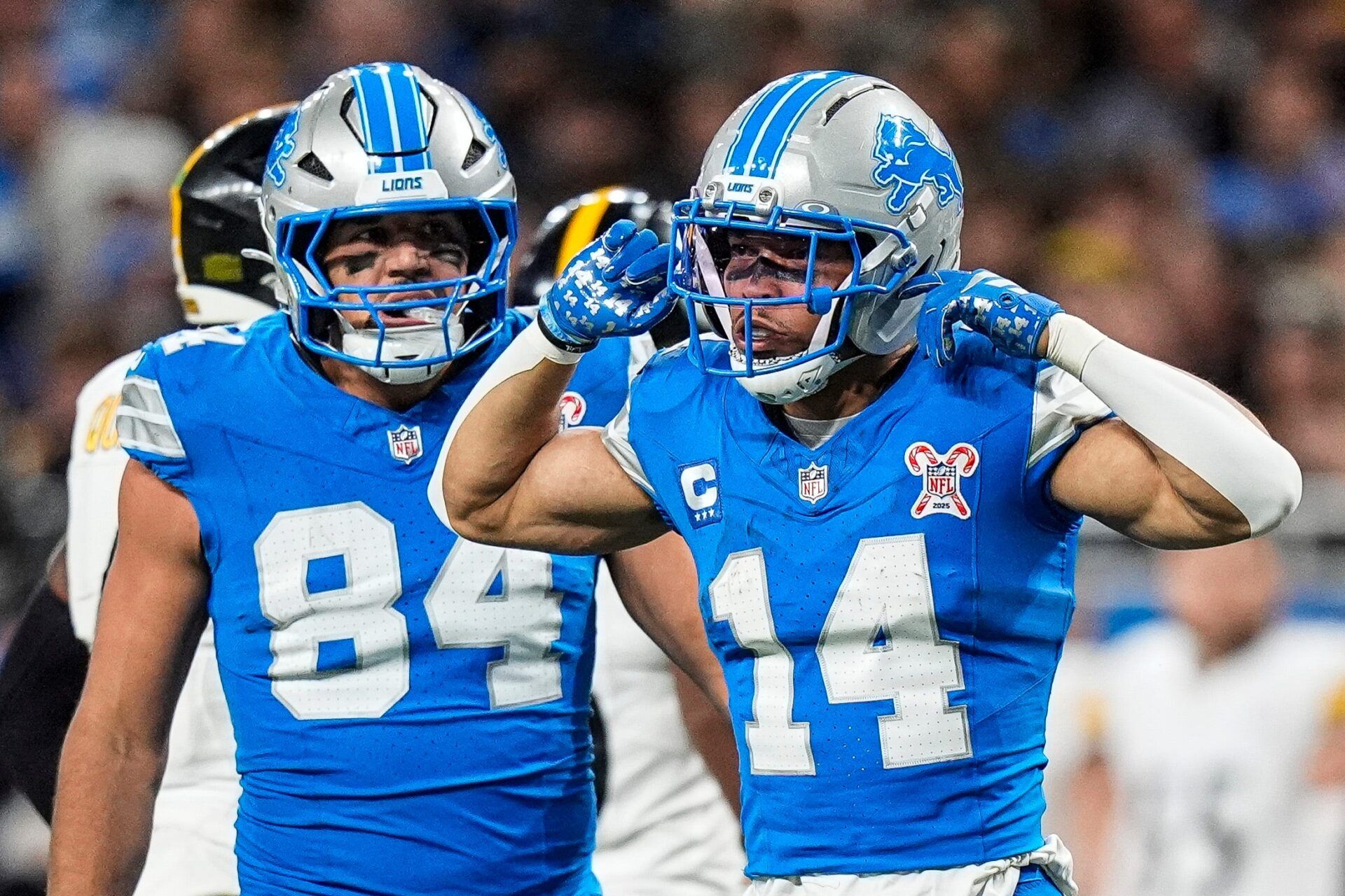Detroit Lions wide receiver Amon-Ra St. Brown (14) celebrates a first down against Pittsburgh Steelers during the first half at Ford Field in Detroit on Sunday, Dec. 21, 2025.
