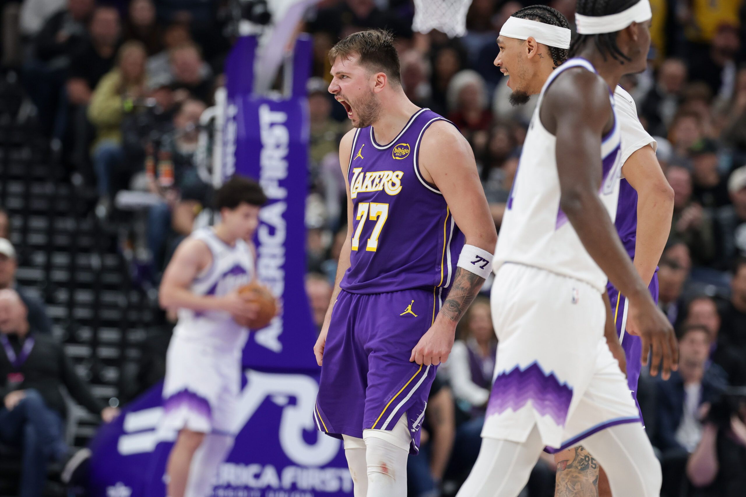 Los Angeles Lakers forward/guard Luka Doncic (77) celebrates after scoring a three point basket during the second half against the Utah Jazz at Delta Center.
