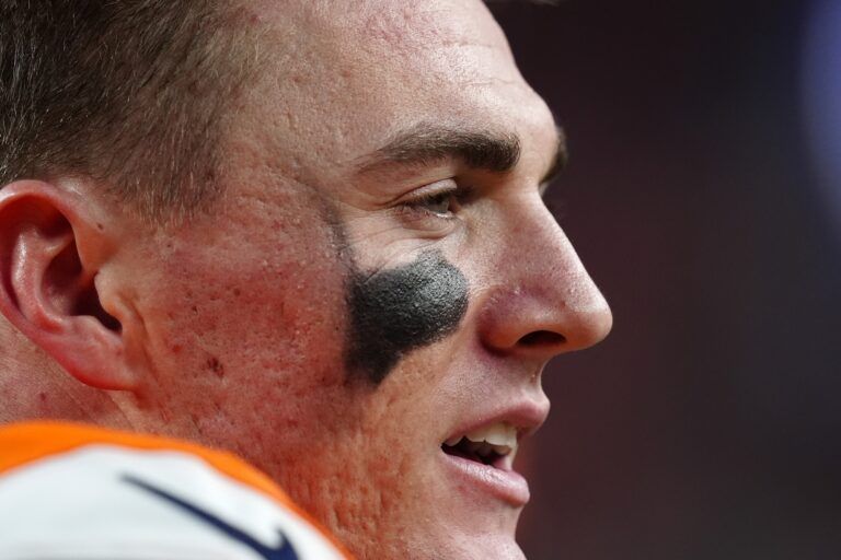 Denver Broncos quarterback Bo Nix (10) reacts on the bench against the Jacksonville Jaguars during the second half at Empower Field at Mile High.