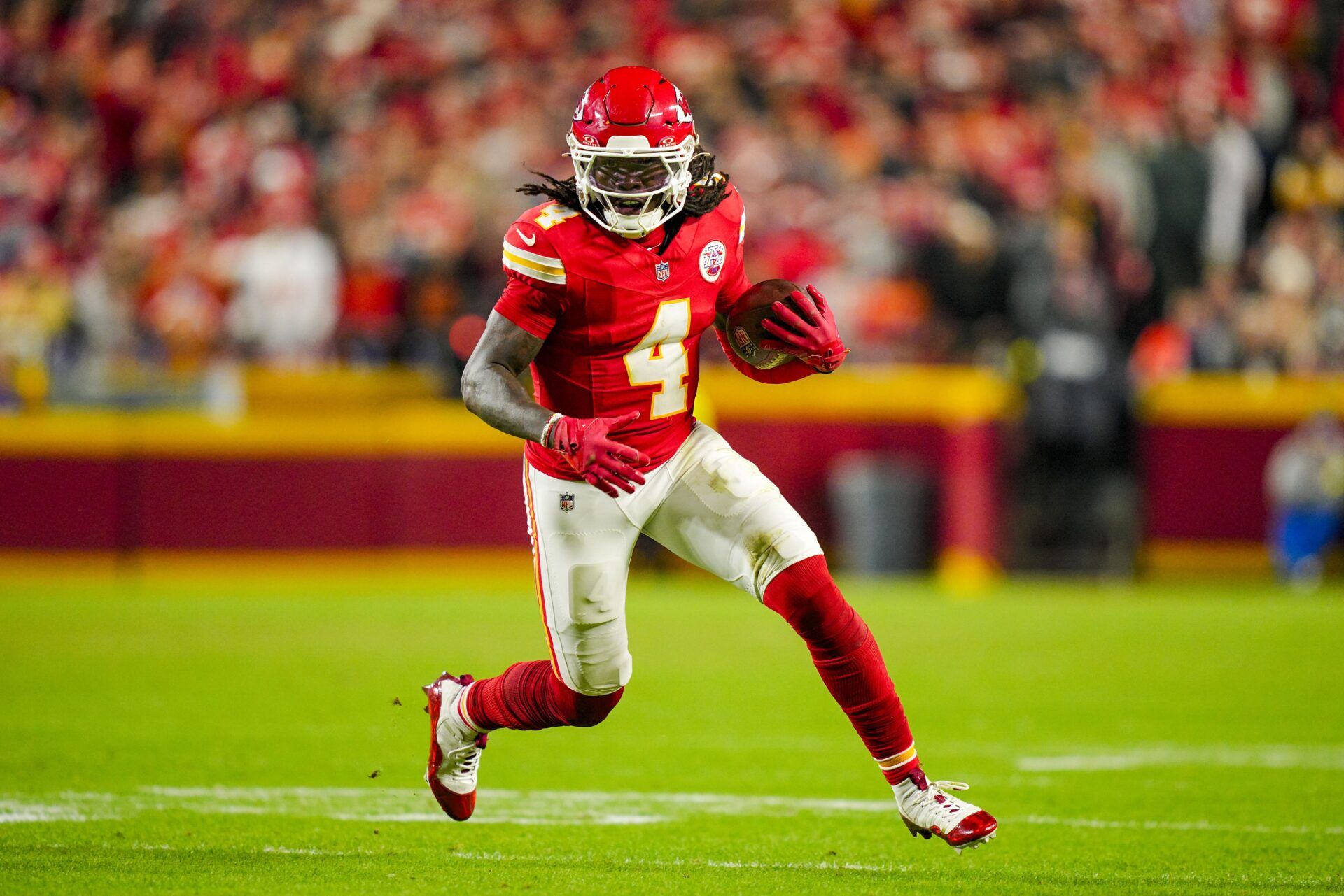 Kansas City Chiefs wide receiver Rashee Rice (4) runs with the ball during the second half against the Washington Commanders at GEHA Field at Arrowhead Stadium.