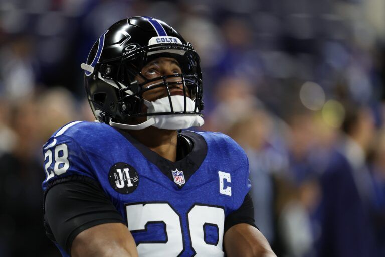 Indianapolis Colts running back Jonathan Taylor (28) looks on during warmups before the game against the San Francisco 49ers at Lucas Oil Stadium.
