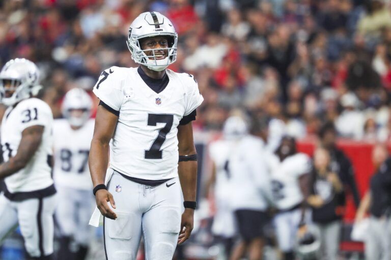 Las Vegas Raiders quarterback Geno Smith (7) reacts after throwing a touchdown pass against the Houston Texans during the second quarter at NRG Stadium.