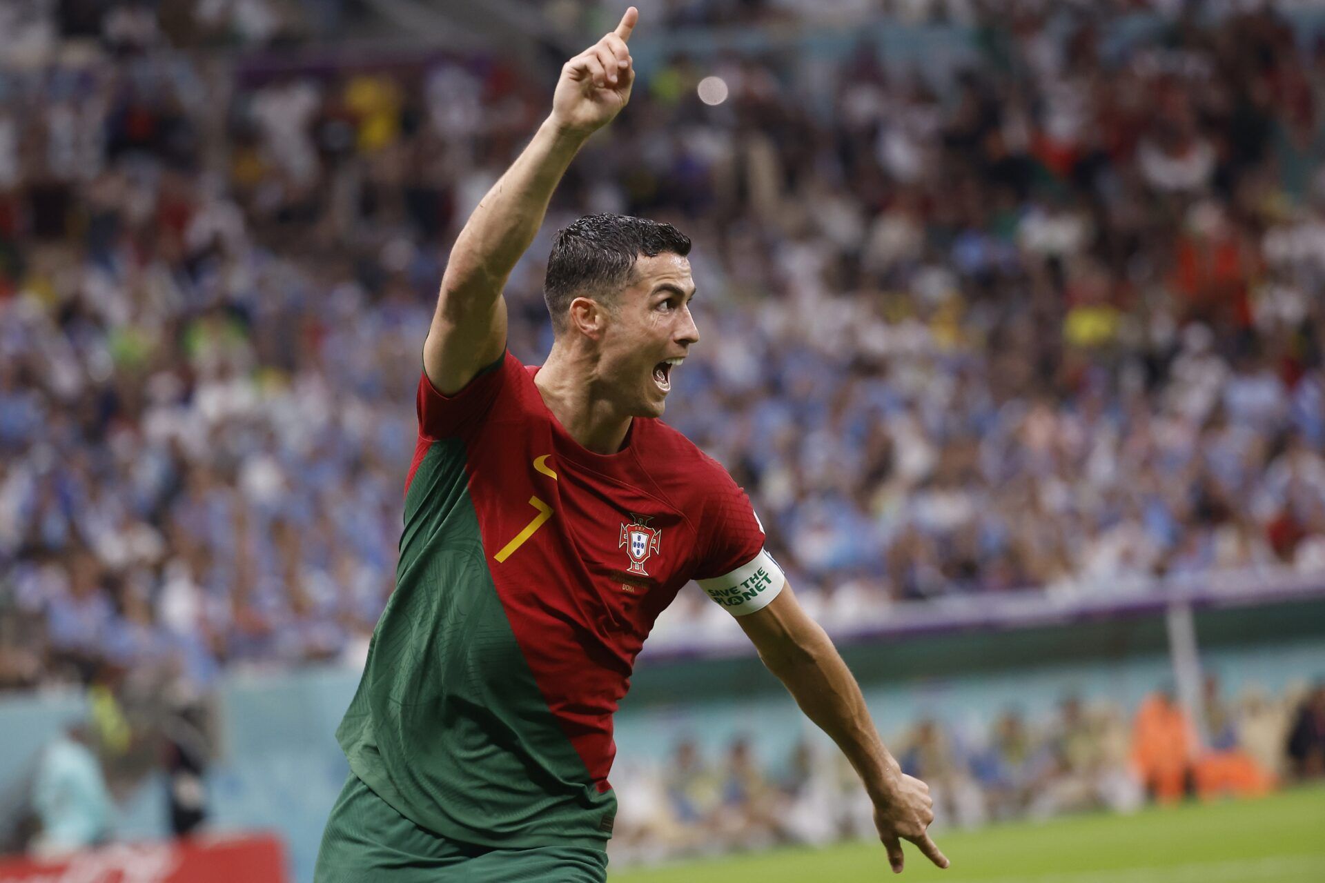Portugal forward Cristiano Ronaldo (7) celebrates his goal scored against Uruguay during the second half of the group stage match in the 2022 World Cup at Lusail Stadium. The goal would instead be credited to midfielder Bruno Fernandes (8).