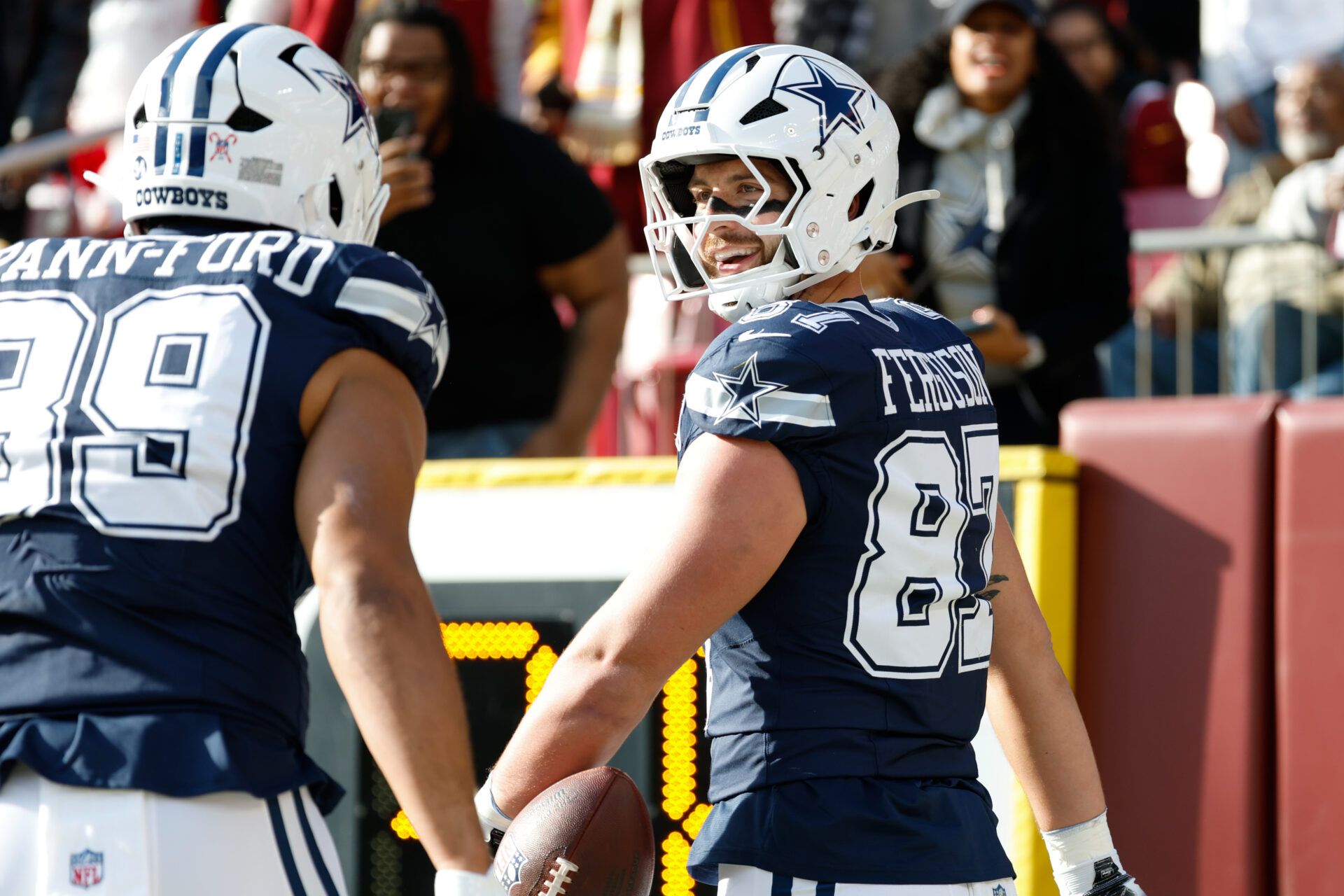 Dallas Cowboys tight end Jake Ferguson (87) celebrates after scoring a touchdown against the Washington Commanders in the first quarter at Northwest Stadium.