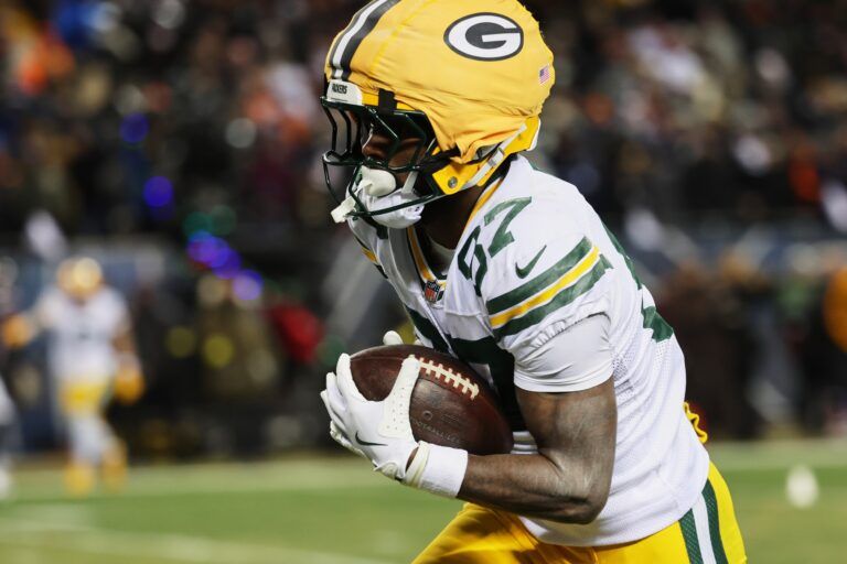Green Bay Packers wide receiver Romeo Doubs (87) runs for a touchdown after catching a pass thrown by quarterback Malik Willis (not pictured) against the Chicago Bears during the third quarter at Soldier Field.